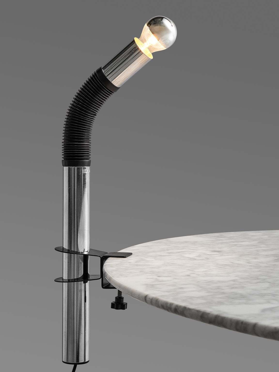 Targetti Sankey chandelier, made in chromed metal and plastic, Italy, 1970s. 

This chandelier made out of one pipe, and is designed as a postmodern way to interpret lighting. The pipe presents half of its body in rubber, it is designed as if it