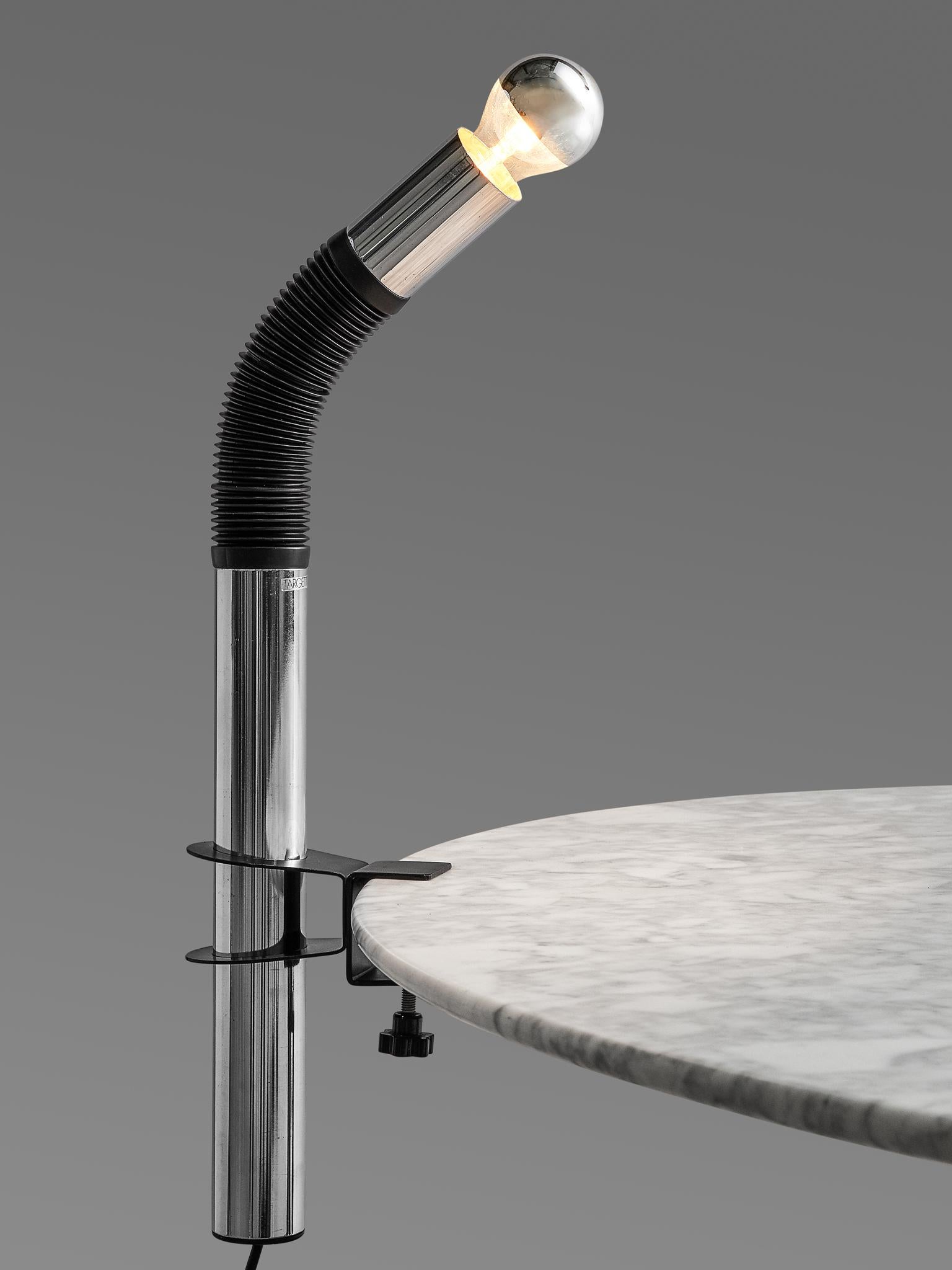 Targetti Sankey chandelier, made in chromed metal and plastic, Italy, 1970s. 

This chandelier made out of one pipe, and is designed as a Postmodern way to interpret lighting. The pipe presents half of its body in rubber, it is designed as if it was