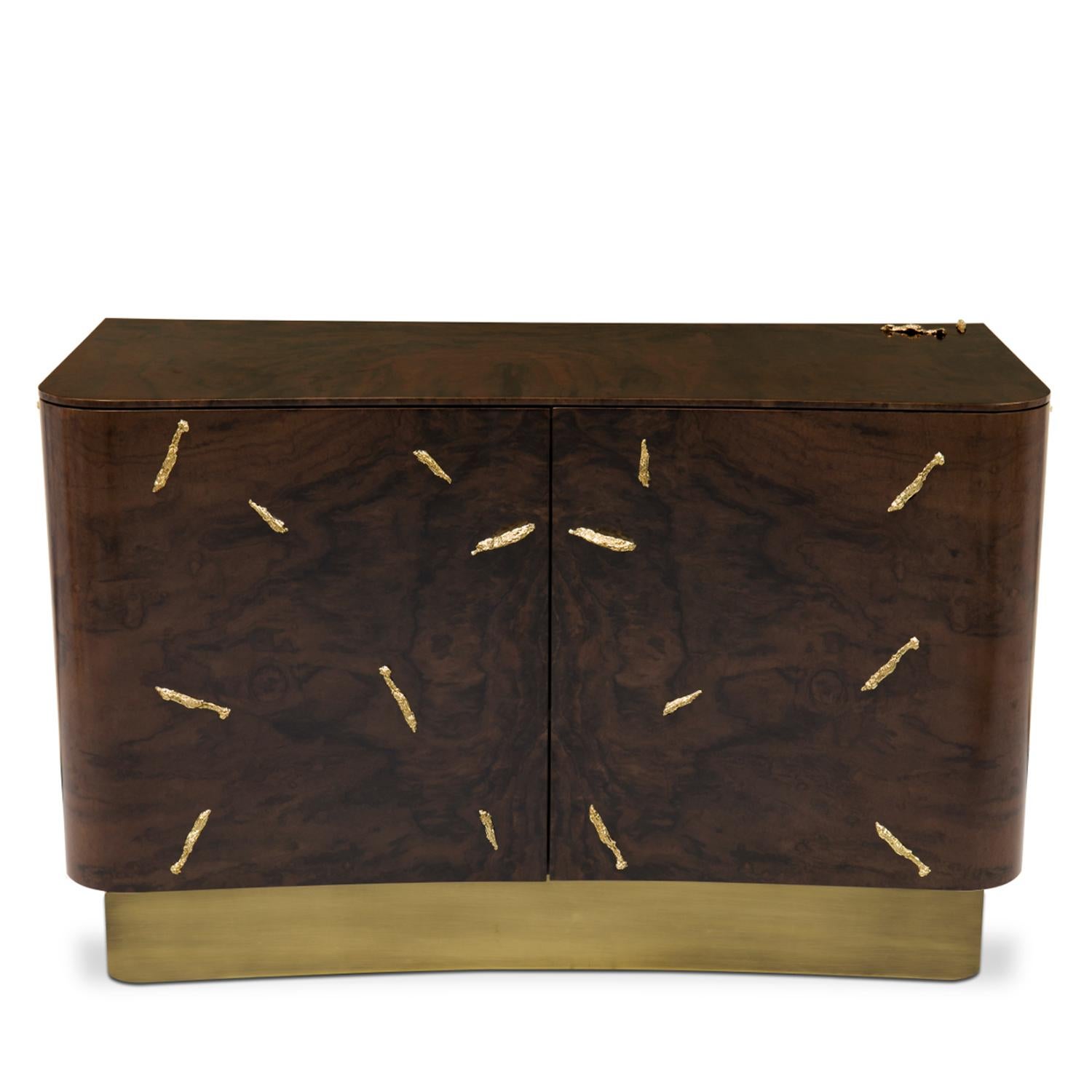 Cabinet Dresser Tarius Large with wooden structure with solid walnut
veneer in matte finish. With polished solid brass details and with
brushed aged brass base. With 2 doors and 2 drawers made inside 
with solid poplar wood veneer with walnut veneer