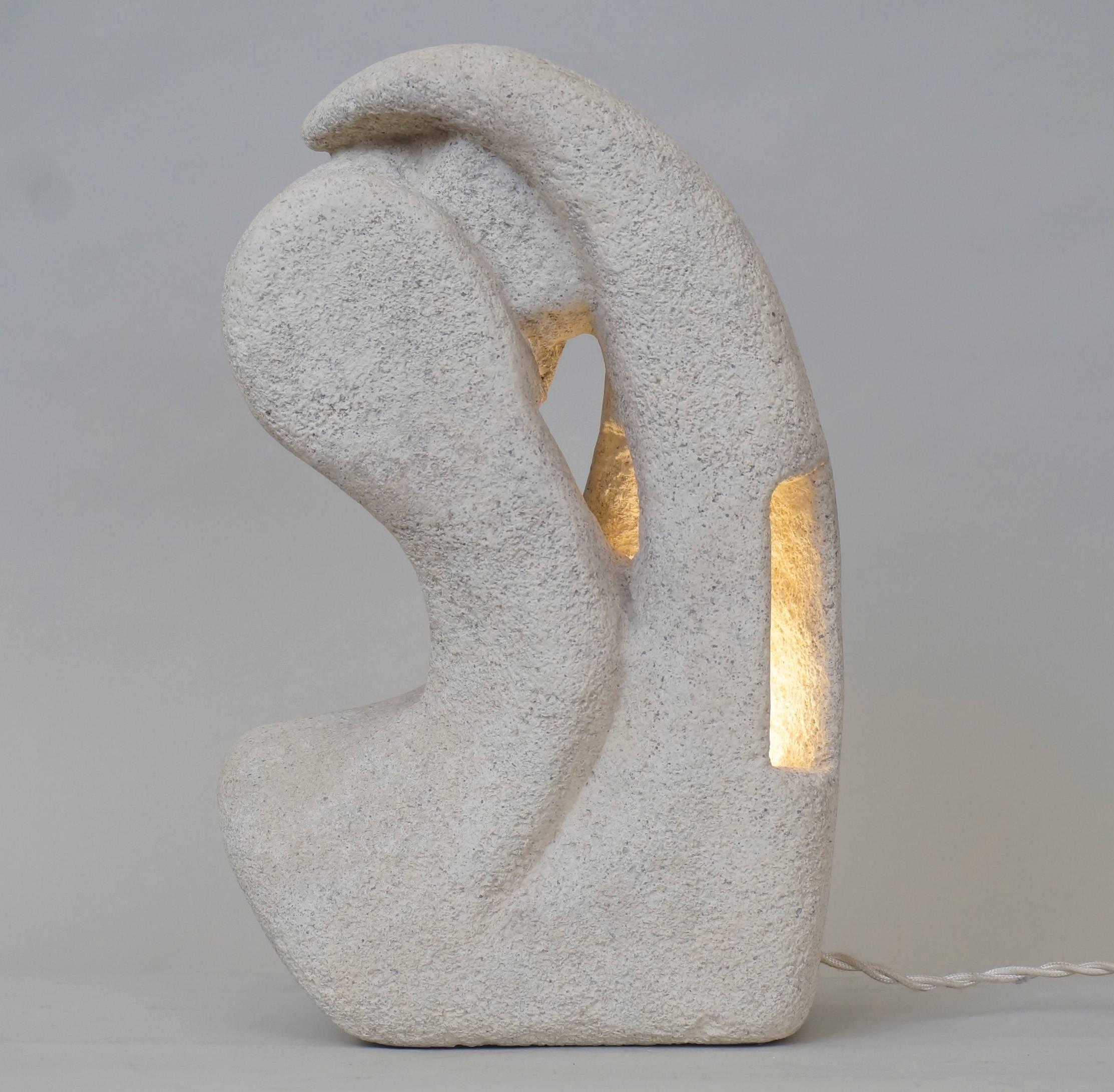 Stone table lamp by Albert Tarnos, monogrammed AT, custom made fabric lampshade, rewired with twisted silk cord.

Measure: Height 31 cm - 12.2 in.
  