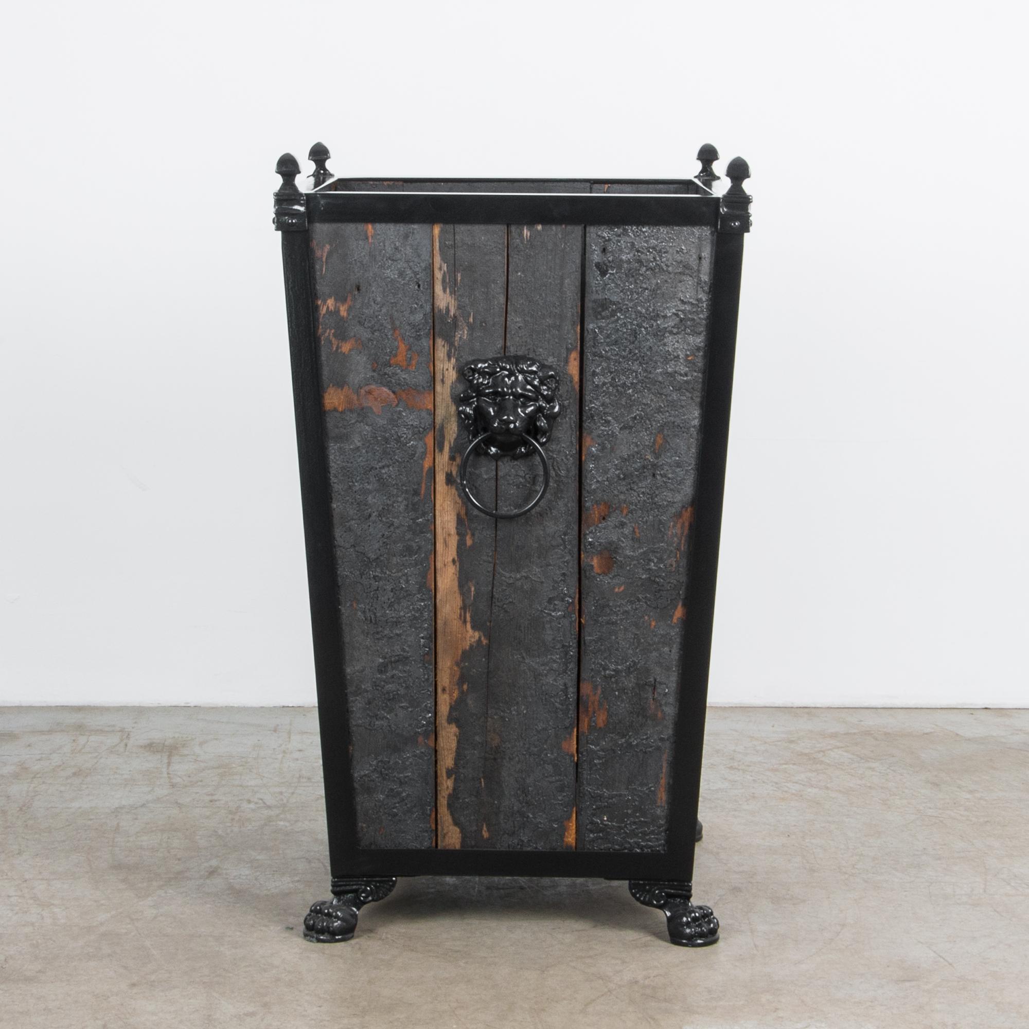 A sturdy wooden garden planter produced in our atelier. Finished with dramatic black tar, this wooden planter combines aged pine and sleek painted metal for an atmospheric texture. The textured finish compliments a Classic combination of metal and