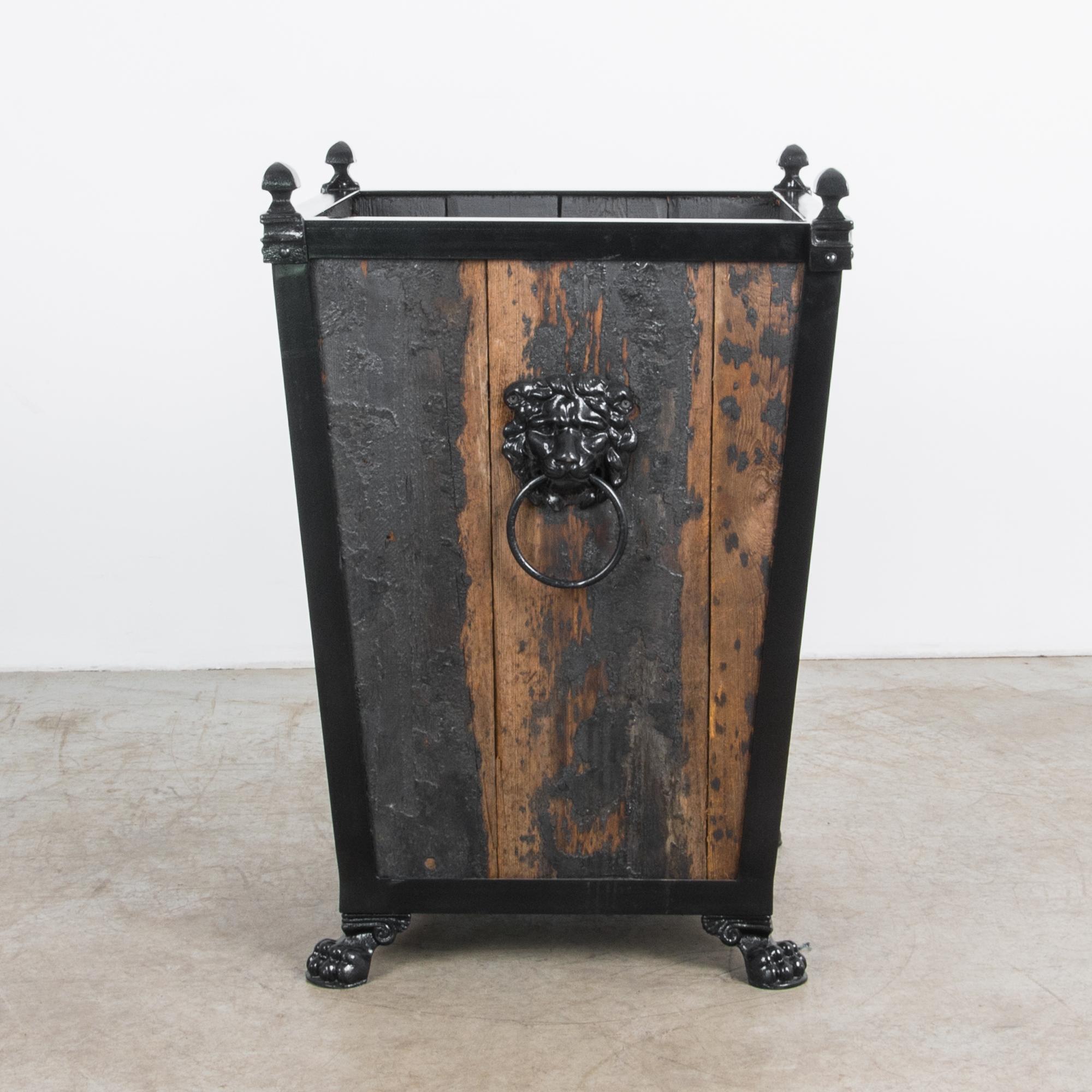 A sturdy wooden garden planter produced in our atelier. Finished with dramatic black tar, this wooden planter combines aged pine and sleek painted metal for a lightly atmospheric texture. The textured finish compliments a classic combination of