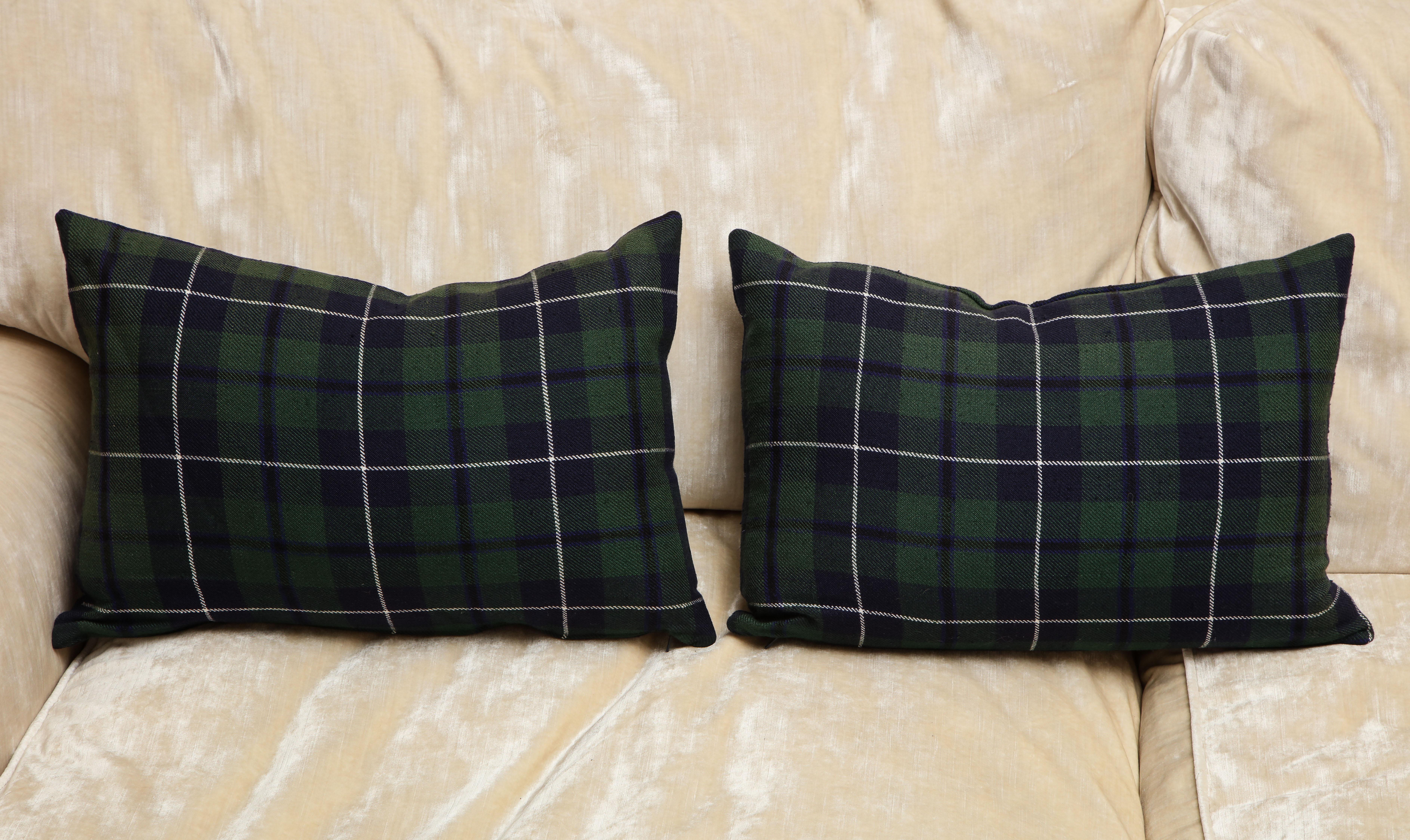 The Tartans pillows are one of a kind. The woven wool style is associated to Clan Urquhart from Scotland. It's navy blue and forest green plaid is typically from them. This pair of custom-made pillows are designed by Arlene Angard and
with a insert