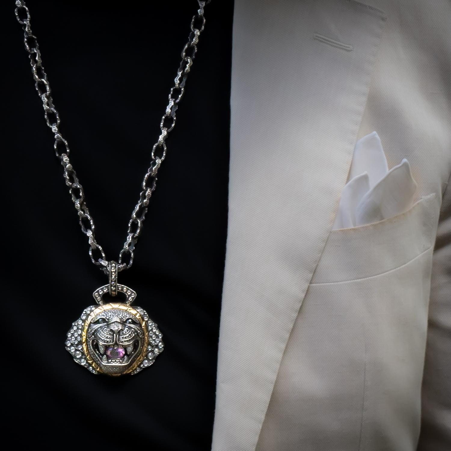 This stunning signature series lion necklace is crafted from 18 karat gold and sterling silver and features a magnificent mane set with antique rosecut white diamonds. The face of the lion is fully encrusted with sparkling champagne, brown, and