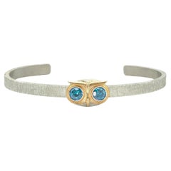 Taru Jewelry Owl Blue Topaz Yellow Gold and Silver Bangle Bracelet