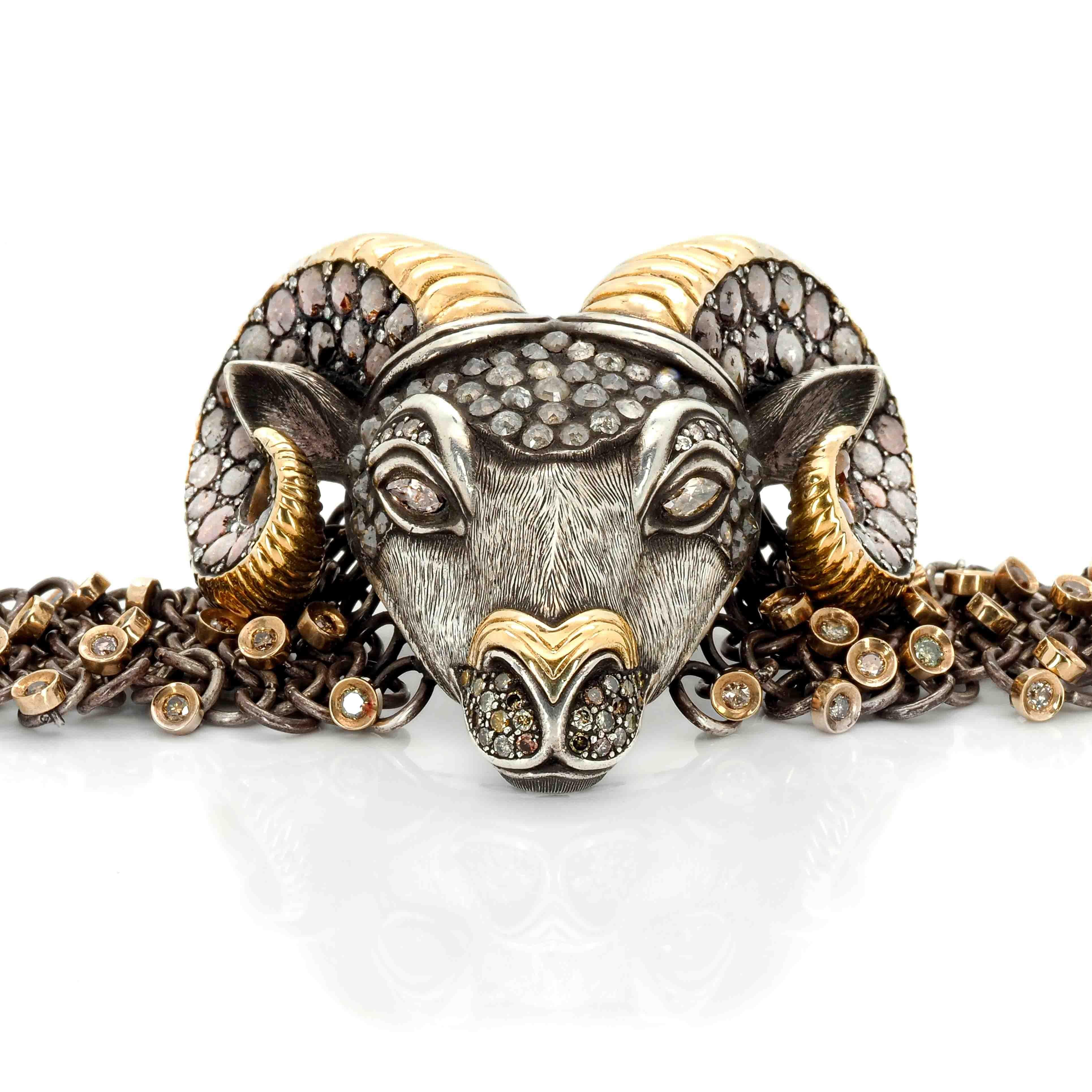 The signature series Ram Bracelet, handcrafted from 18k gold, sterling silver, and various diamonds is the epitome of luxury and elegance. The frontal view of the Ram's 18k gold horns is designed to resemble a spiral, a symbol of eternity. The Ram