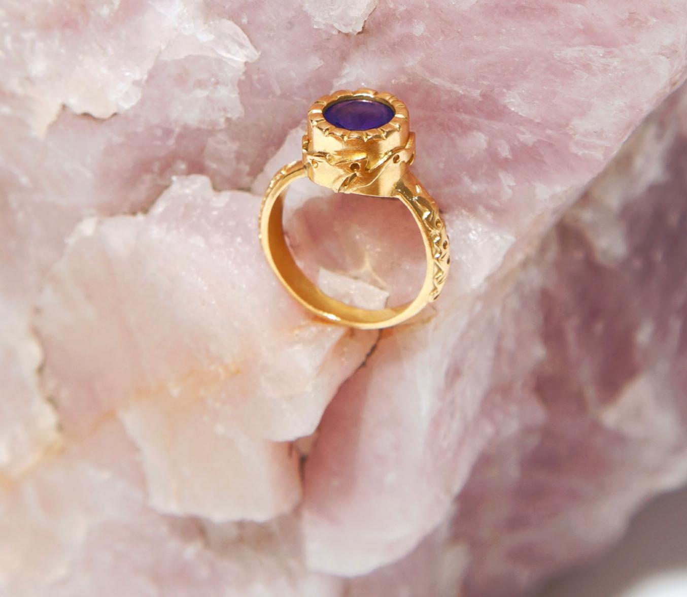 The Tarzan ring is a very unique design, strong in its baroque artesanal touch, 10 grams of 18 carat solid gold with a 1.5 Tanzanite.  This piece of art is inspire by the most ancient civilizations on earth, it has a manuscrito draw in it with a