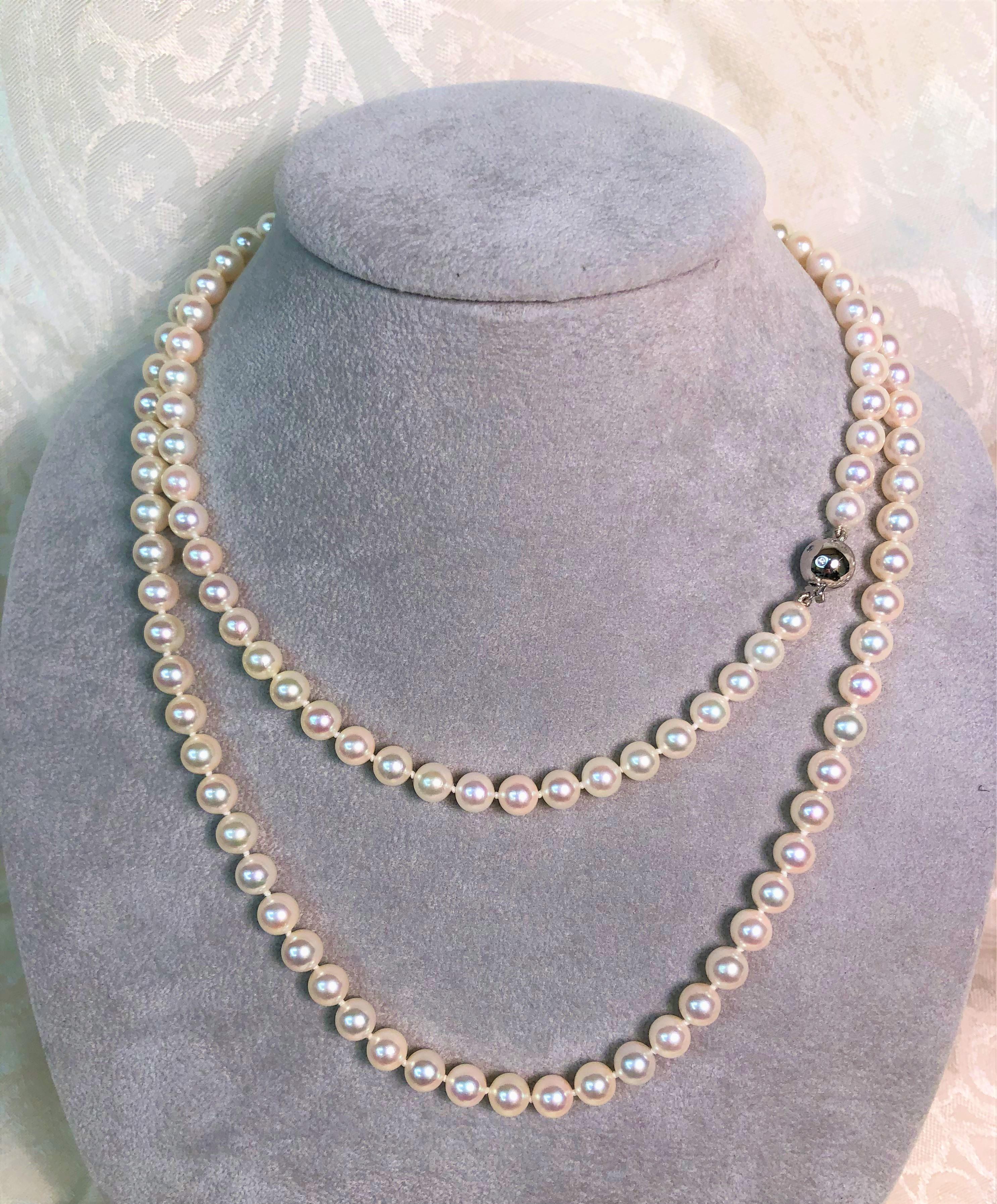 From designer Tasaki- these beautiful pearls can be worn long or doubled for a different look.  Perfect size for everyday!!
126 white Akoya pearls, each 6.5mm - 7mm round.  Bright luster.  Knotted.  Beautiful!!
18K white gold ball clasp with