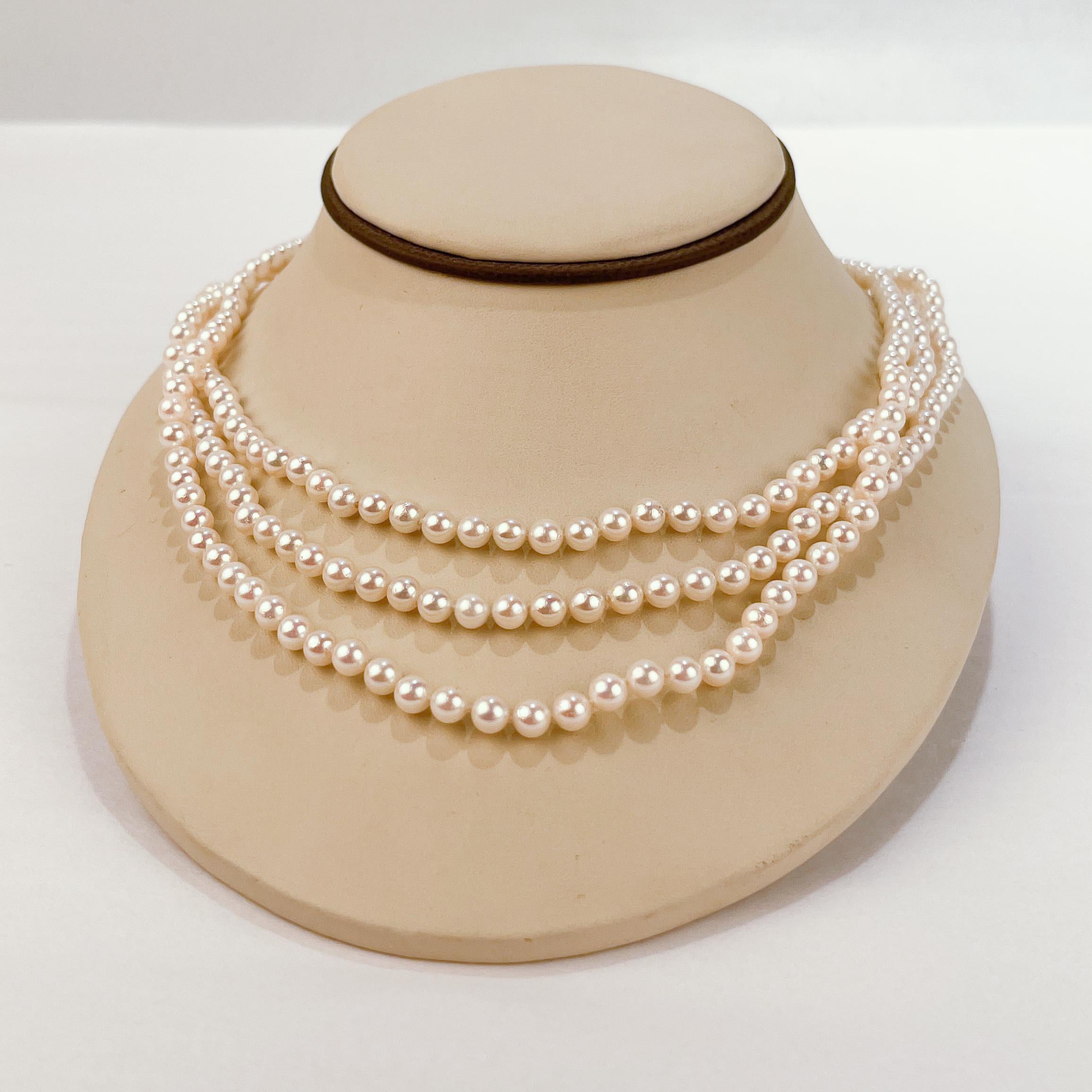 Round Cut Tasaki 3-Strand Akoya Pearl, 14 Karat Gold & Ruby Necklace