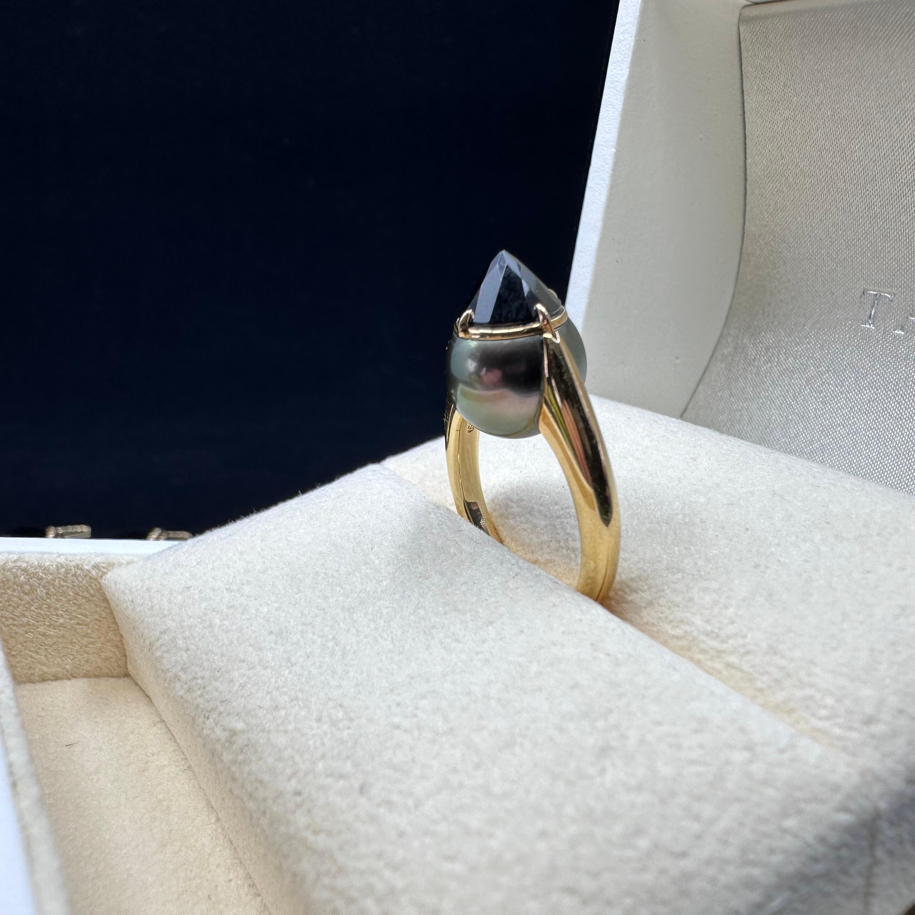 Vintage Original Tasaki's Refined Rebellion Signature Black Spinel Yellow Gold Ring. 
Seamlessly Connecting Yellow Gold, Natural South Sea Pearl, and a Round Brilliant Cut Black Spinel Ring.
The ‘refined rebellion’ collection features sophisticated