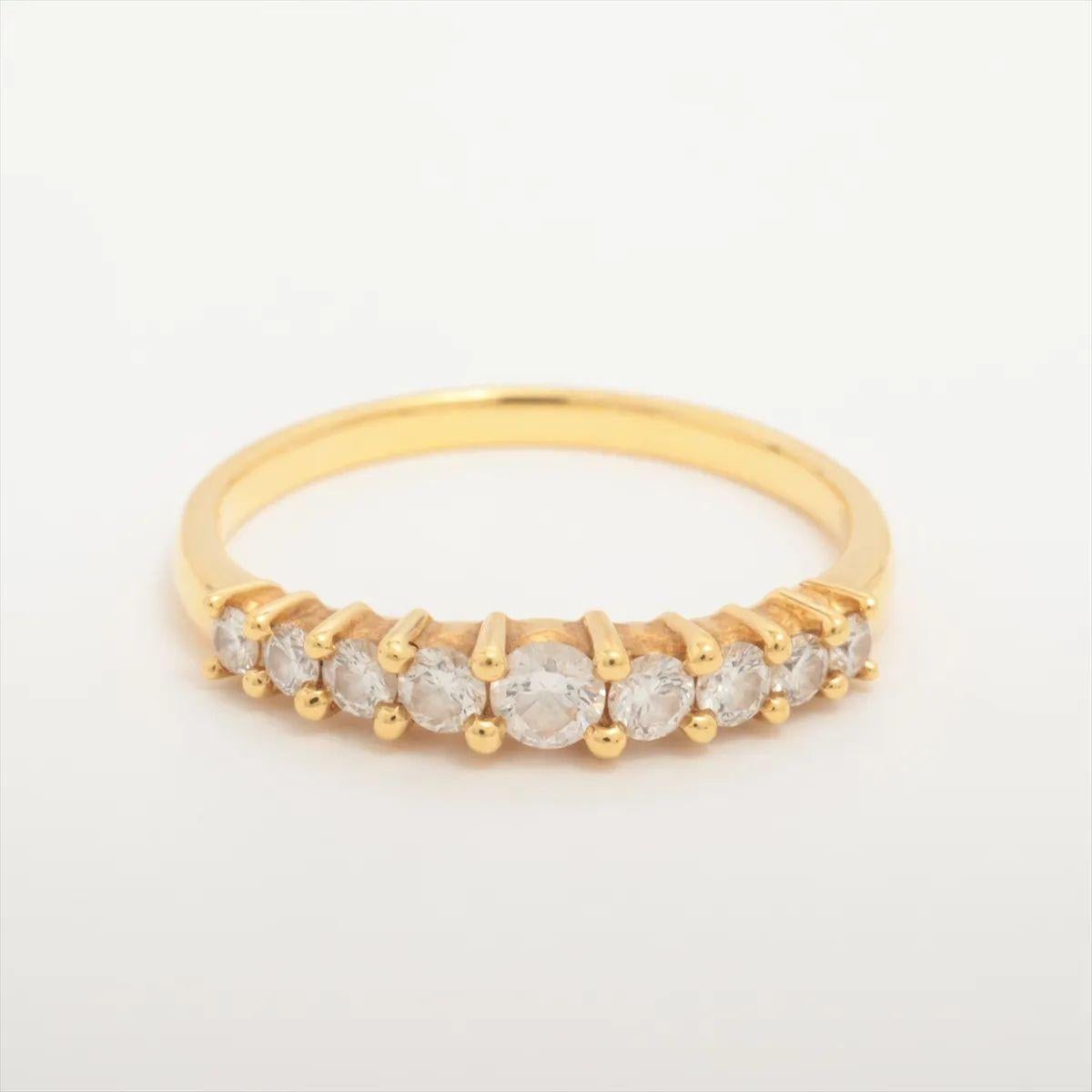 The Tasaki Diamond Ring is a stunning display of elegance and precision, featuring nine graduated diamonds that create a harmonious flow of brilliance across the band. Each diamond is expertly cut and meticulously set to enhance its natural sparkle,