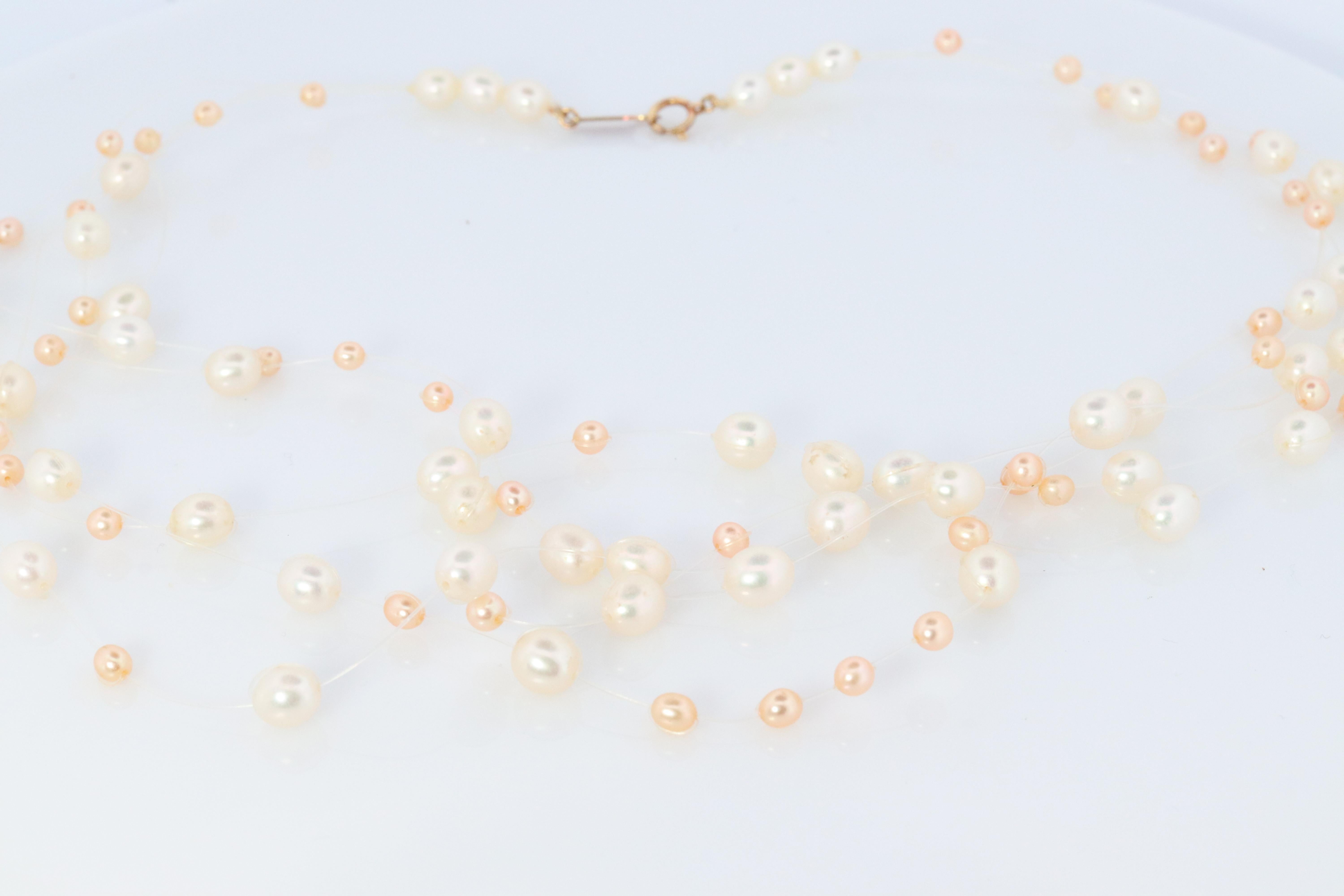An amazing addition to your collection. Very rare
Tasaki Multistrand Necklace

Invisible set multi color pearls.

Clasp 18k Gold. TASAKI

Details:
16in length
