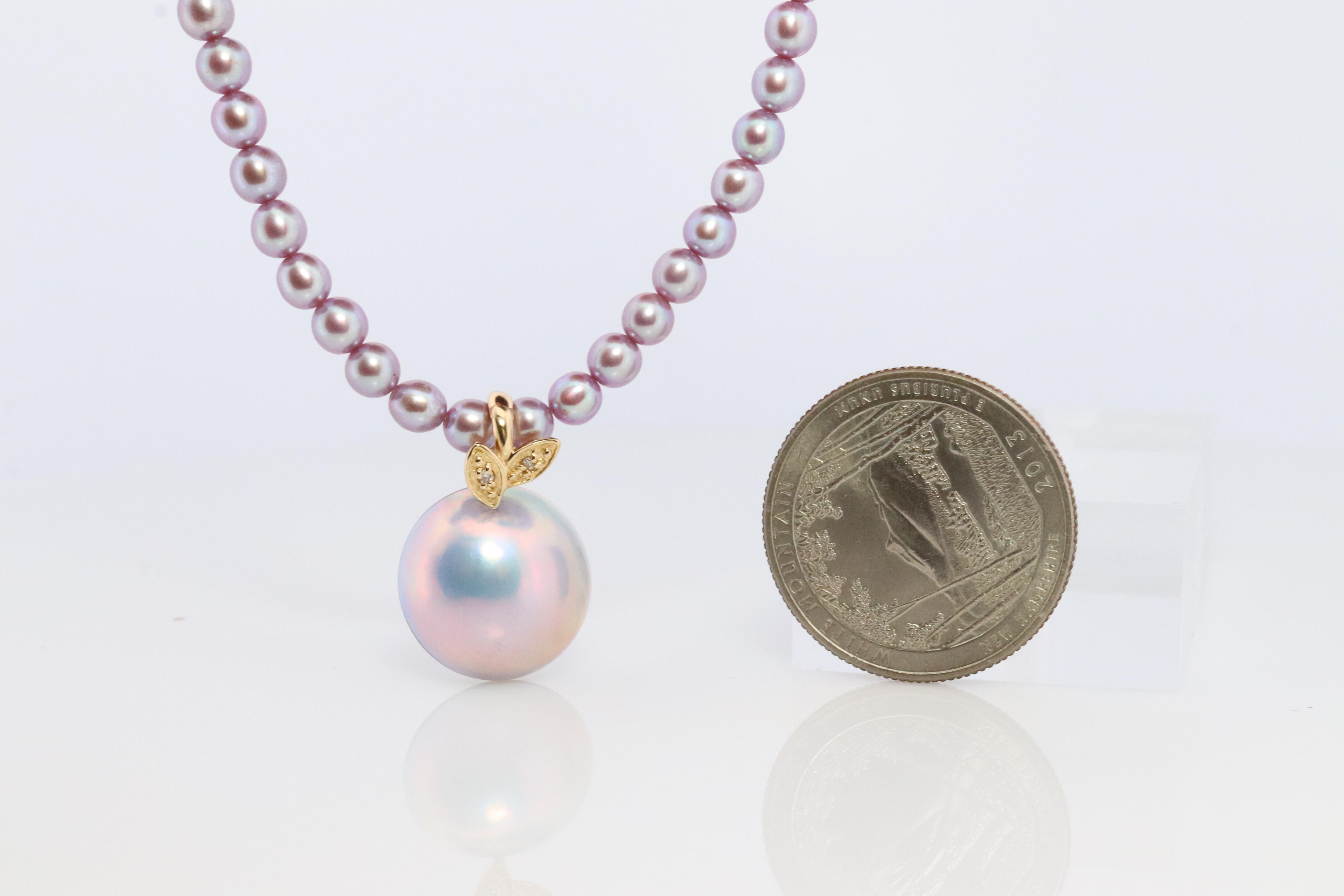 An amazing addition to your collection. Very rare
Tasaki Mabe Pearl with Gray/Blue pearls.
2 tiny diamonds.

Clasp 18k Gold. 

Comes with Original Tasaki Certificate

Details:
17in length chain
4.4mm freshwater blackberry pearls
15mm Mabe Pearl
1mm