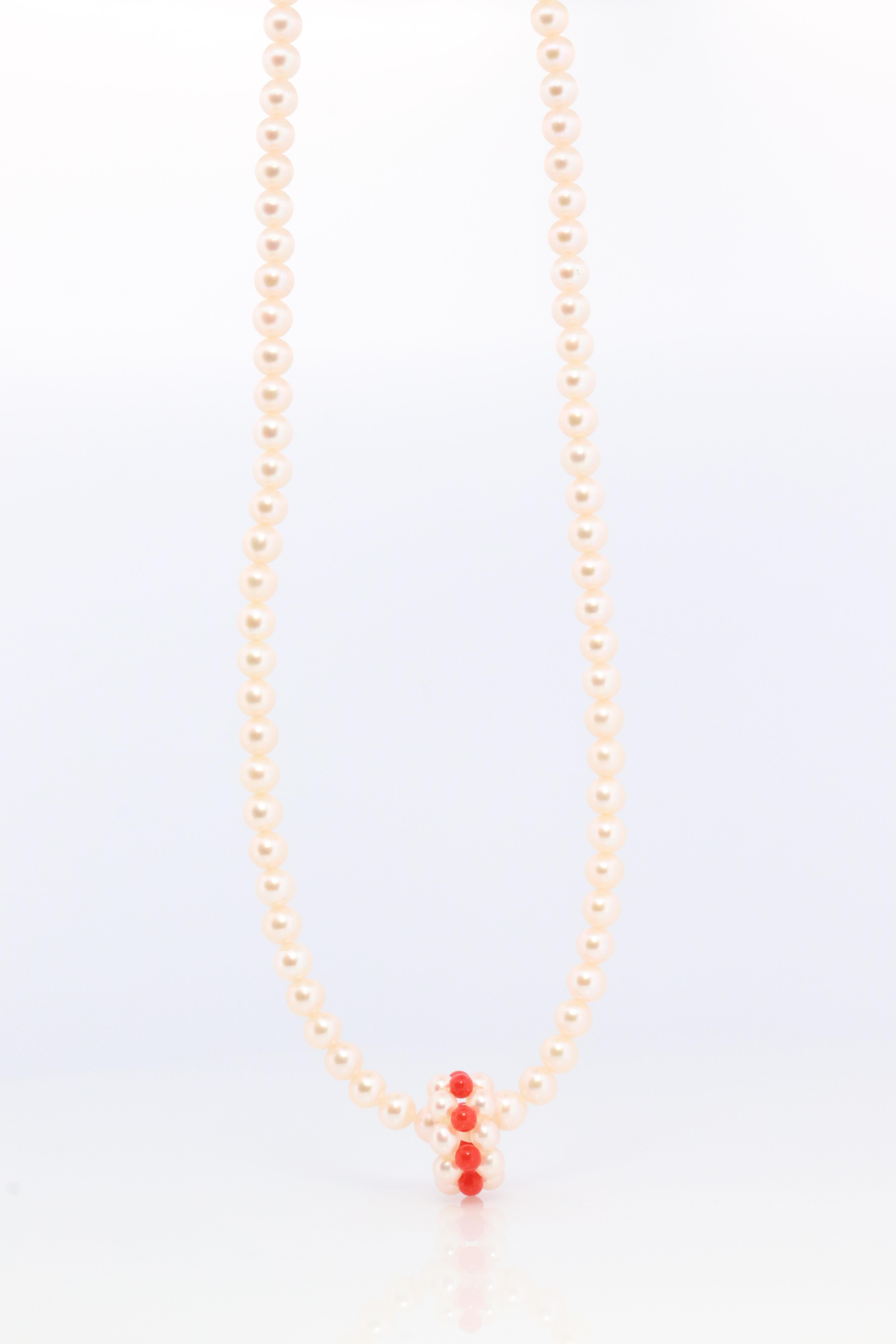 An amazing addition to your collection. Very rare
Tasaki Pearl and Coral Necklace

Clasp 18k Gold.

Details:
17in length chain
4mm saltwater pearls
3mm coral beads.