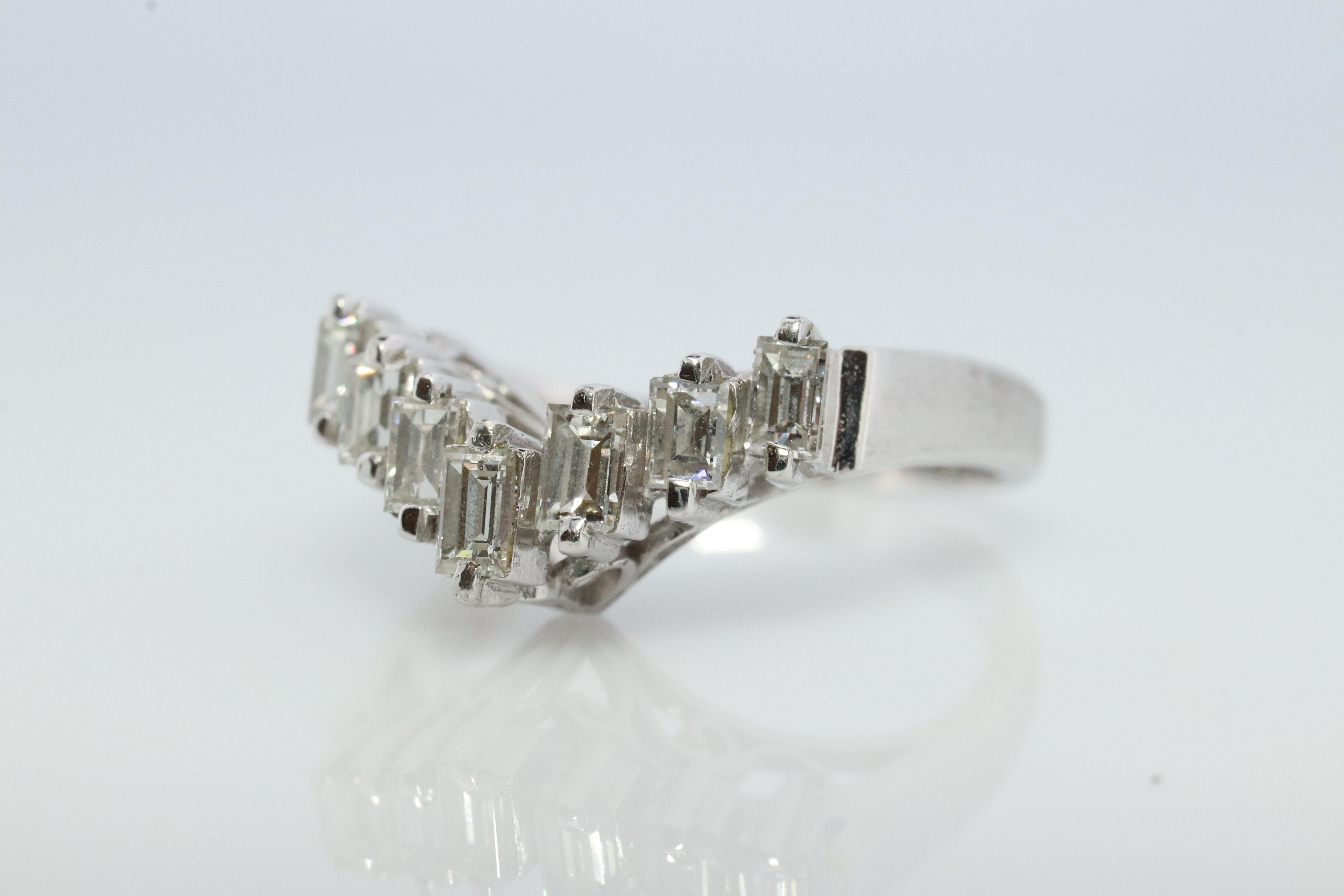 Genuine Tasaki ring

PT900 Platinum with Diamonds.
0.46ctw diamonds

TASAKI Baguette diamonds set to enhance your diamond solitaire.

Details:
Size 4.5
4.1grams total
0.46ctw VS clarity G-H color