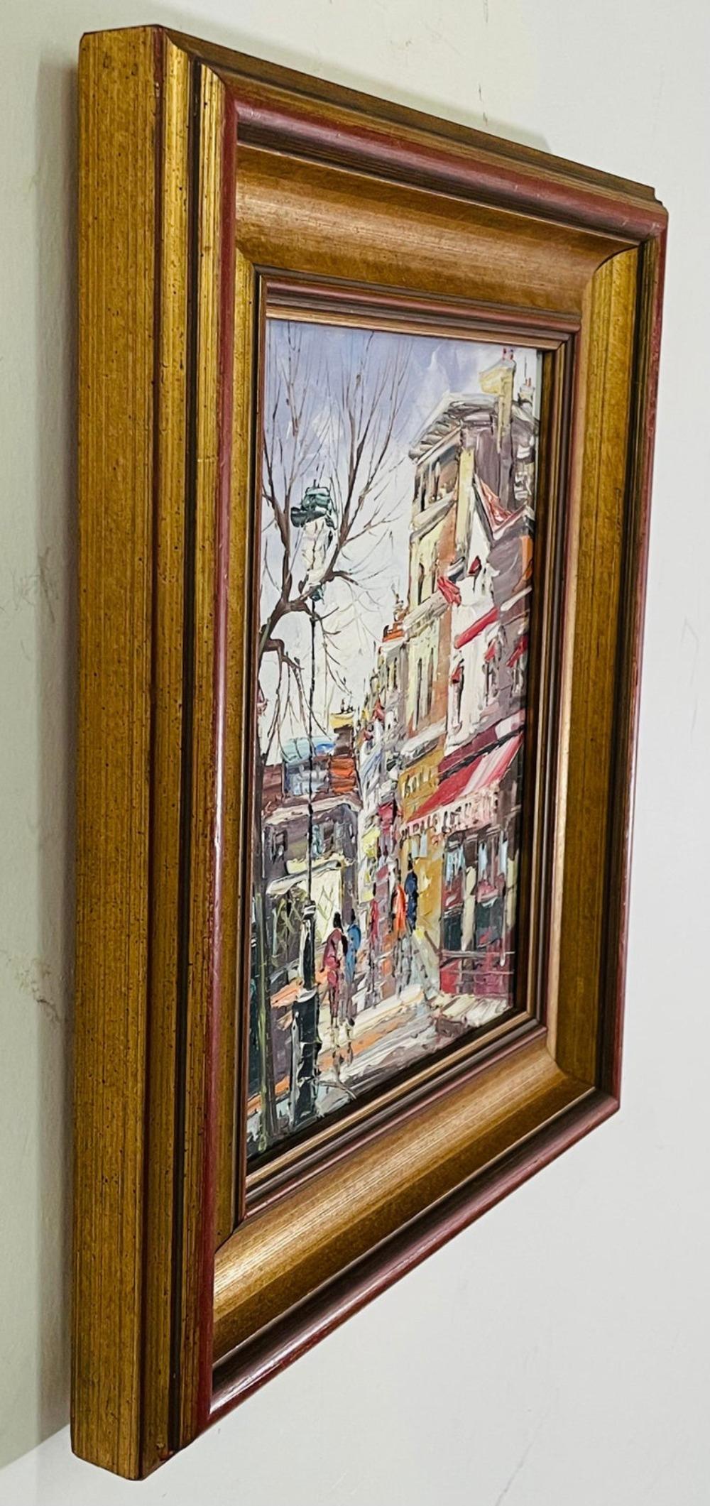 An elegant vintage impressionist oil on canvas painting signed by artist Tasica -1977. The painting features a street scene in the city. It is beautifully framed in a wood frame painted in gold and brown.

Dimensions: 11.5