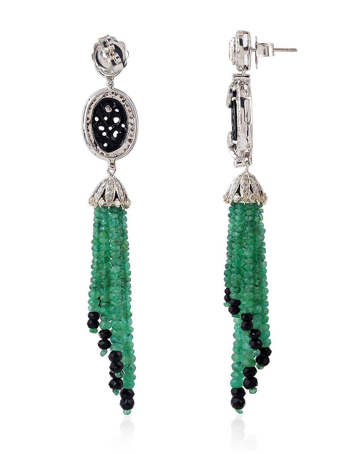 These stunning tassel earrings are handmade in 18-karat gold. It is set with 28.3 carats emerald, 10.24 carats onyx and 2.21 carats of glittering diamonds. 

FOLLOW  MEGHNA JEWELS storefront to view the latest collection & exclusive pieces.  Meghna