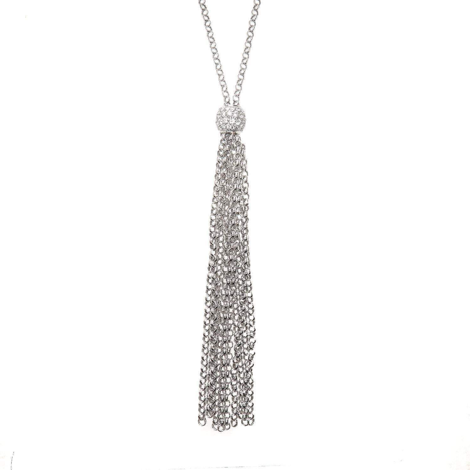 A 38' inch long 18k white gold diamond tassel necklace., The ball hangs 31