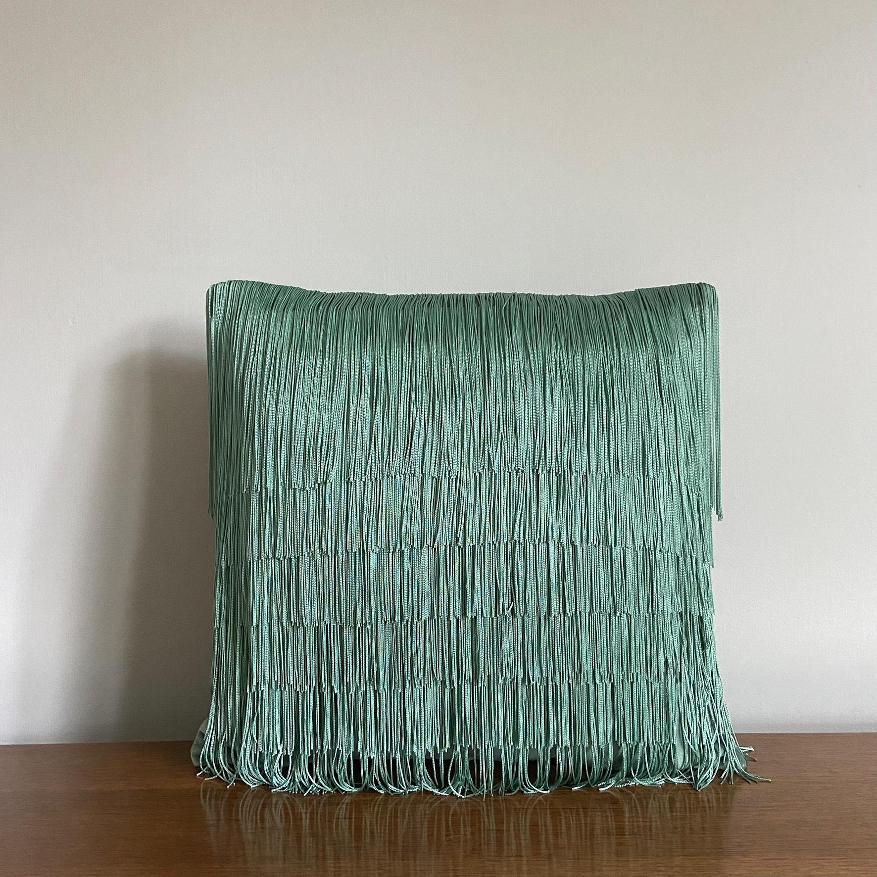 In a jewel-like jade colourway, our signature velvet tassel cushion will make the ultimate decorative statement in your home. Whether you’re a maximalist adding to your many layers of décor or a minimalist wanting to make an impact this cushion does