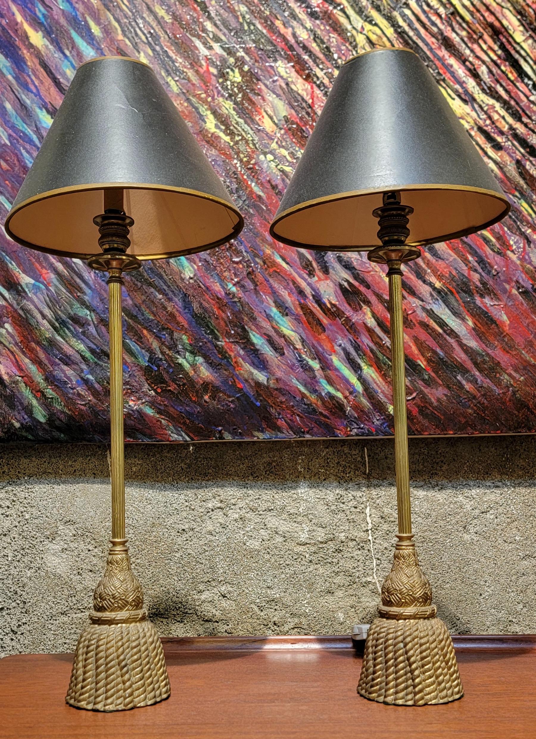 A pair of solid cast brass table lamps in the form of a tassel. Measure 23 inches tall, base measures 3.88 diameter.