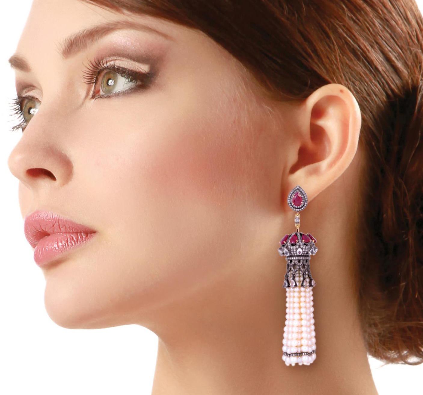 These stunning tassel earrings are handmade in 18-karat gold & sterling silver.  It is set in 8.4 carats ruby, 5.3 carats sapphire, pearl and 4.77 carats of glittering diamonds. 

FOLLOW  MEGHNA JEWELS storefront to view the latest collection &
