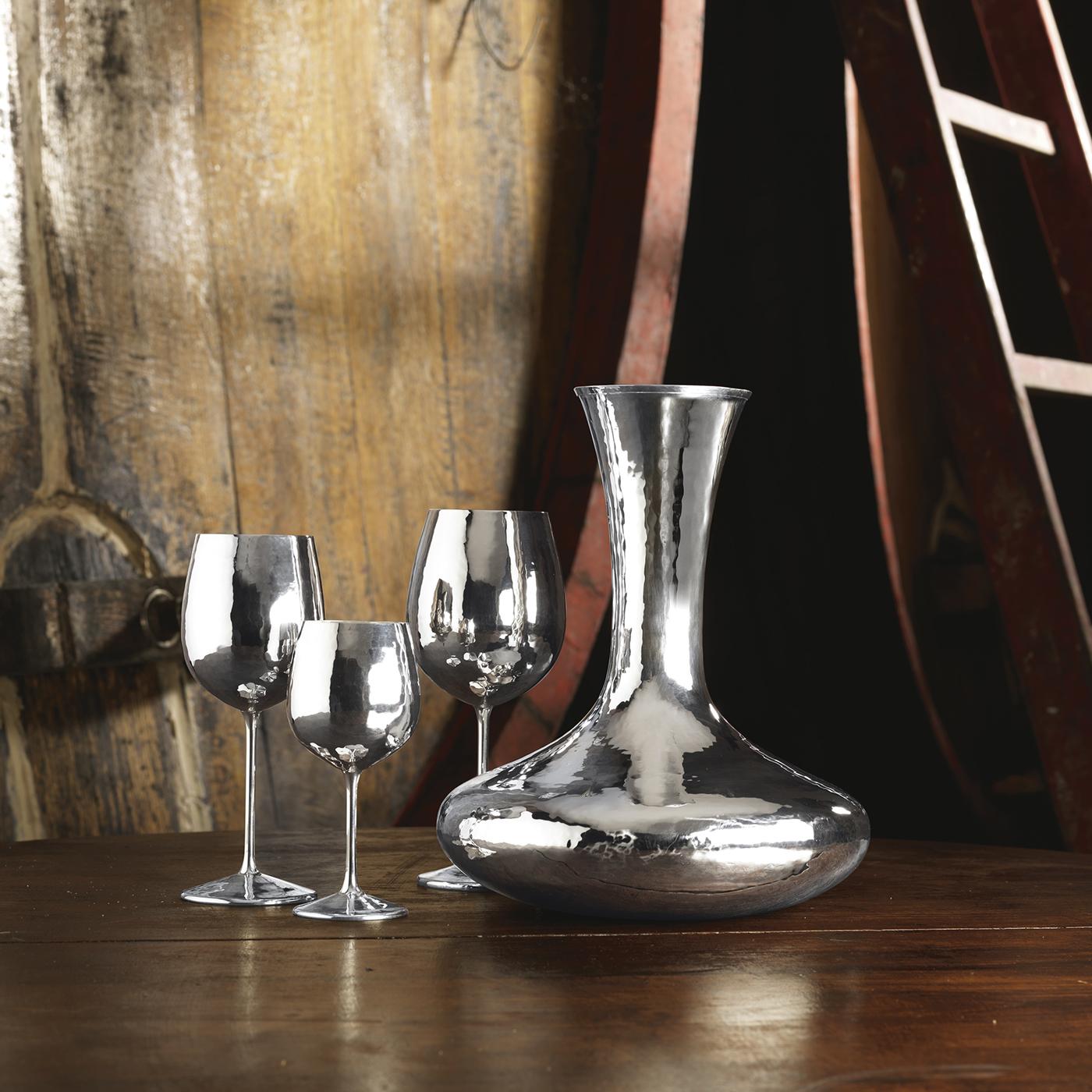 The Taste 3 Wine Glass is crafted in silver, a remarkable material offering antibacterial and antibiotic properties, while maintaining the fine quality and taste of the beverage inside. Offering fine dining finesse with simple forms that contain a