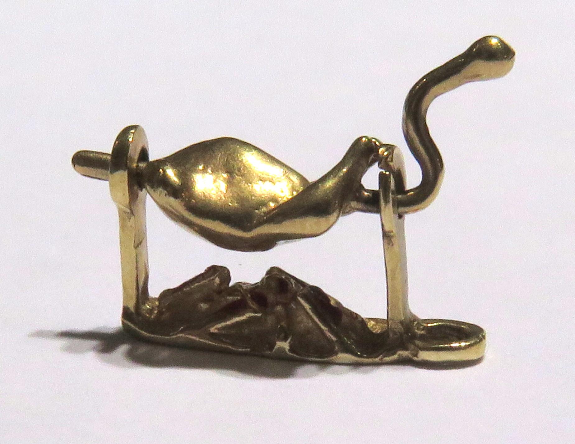 This tasty little treat is sure to satisfy your hunger for the most unique charms. It spins all around so it will cook evenly. It is 14 karat gold.
This charm measures 3/4 inch across the longest section by 1/2 inch high 
This tasty chicken weighs