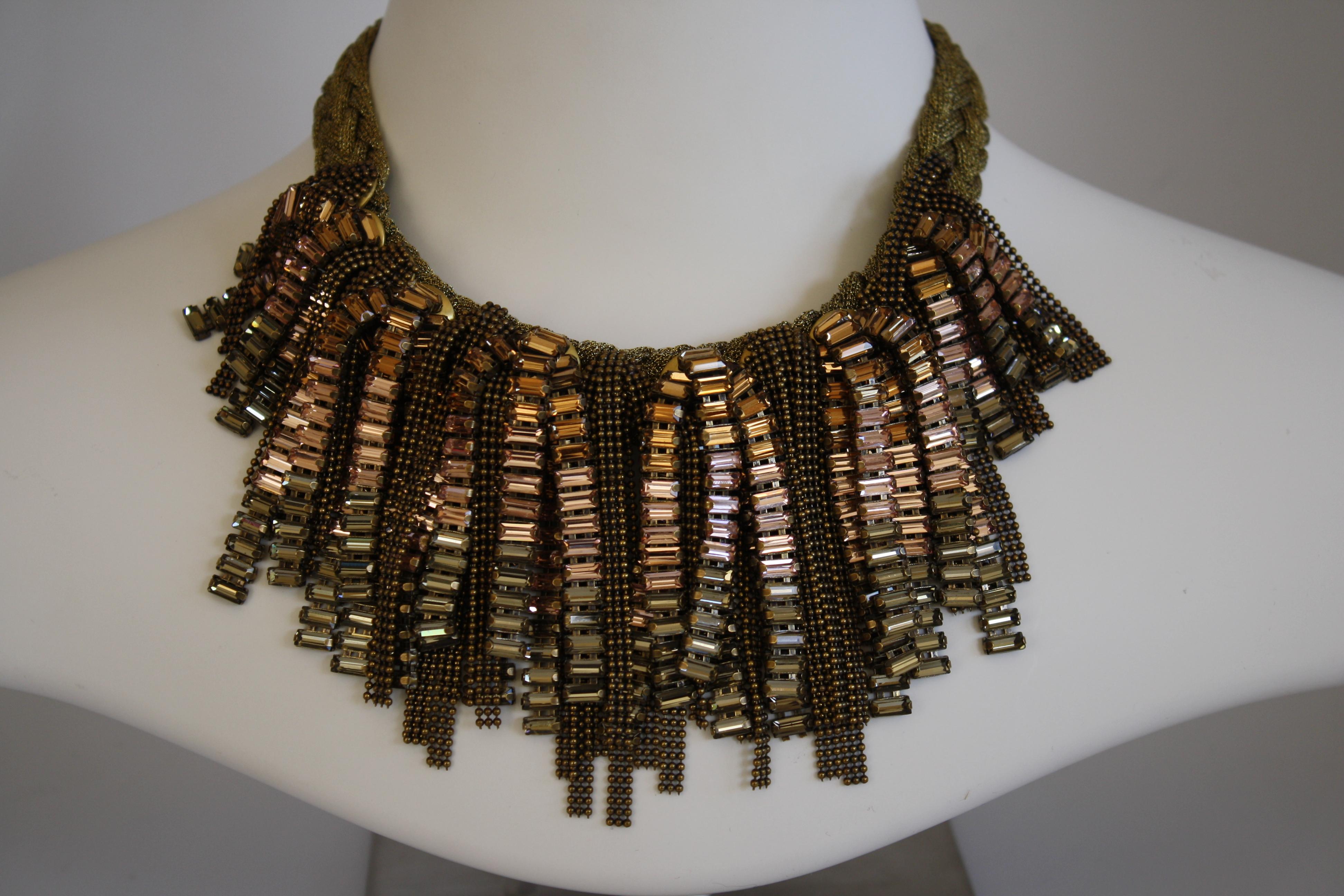 Gorgeous Swarovski Crystal baguette and metal chain fringe necklace on a braided neck from Italian designer Tataborello. 

19