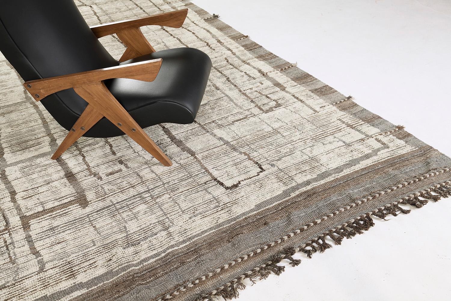 Tatbirt is an interplay between neutral tones and soothing shades into a modern-day interpretation of the Moroccan world. This rug's play of textures, linework, and simplicity is what makes the Atlas Collection so extraordinary and sought after.