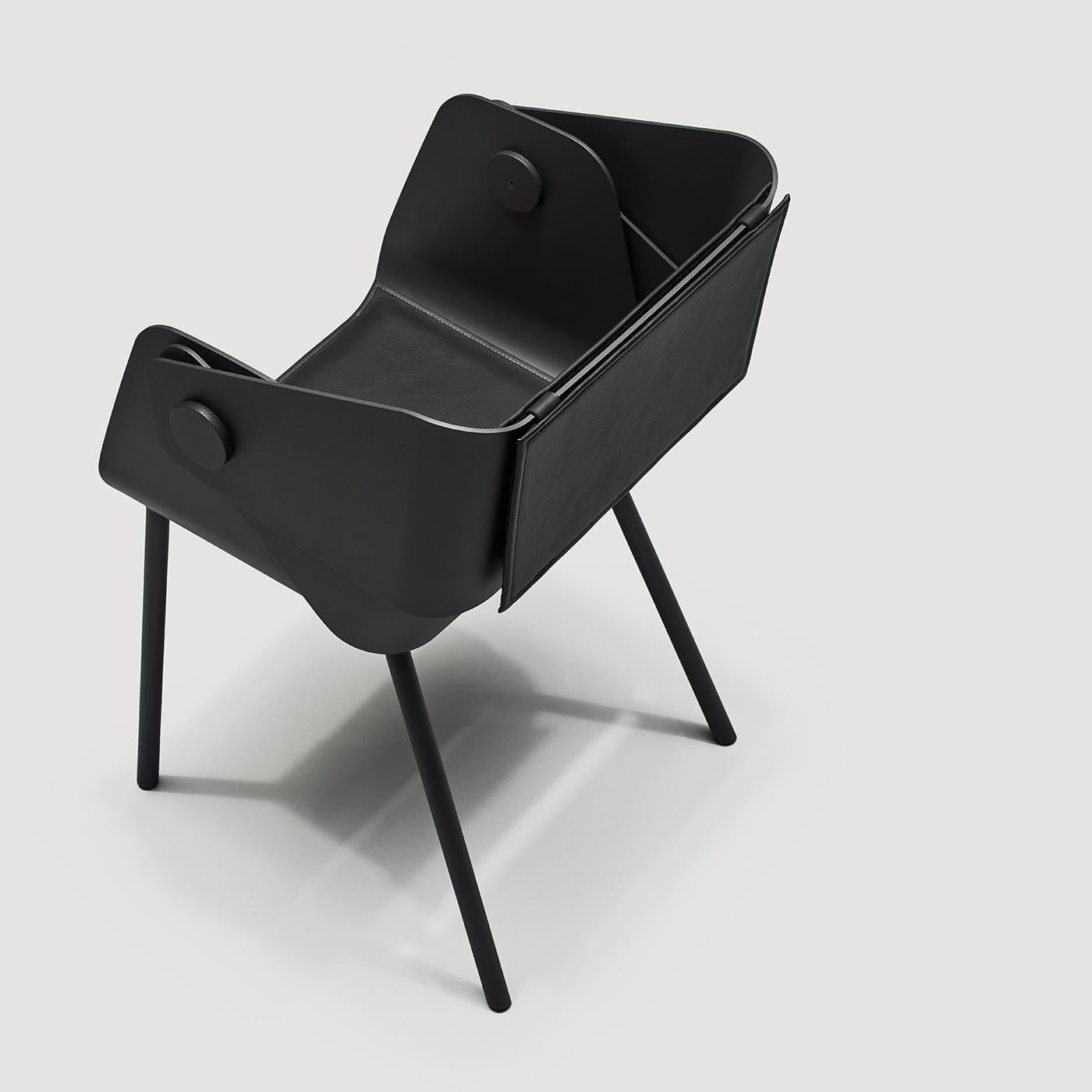 Boasting a bold total-black aesthetic, this armchair has a sculptural flair that will make it statement piece of any interior. Resting on a cylindrical aluminum structure, the arms and backrest are composed by two pieces welded together by round