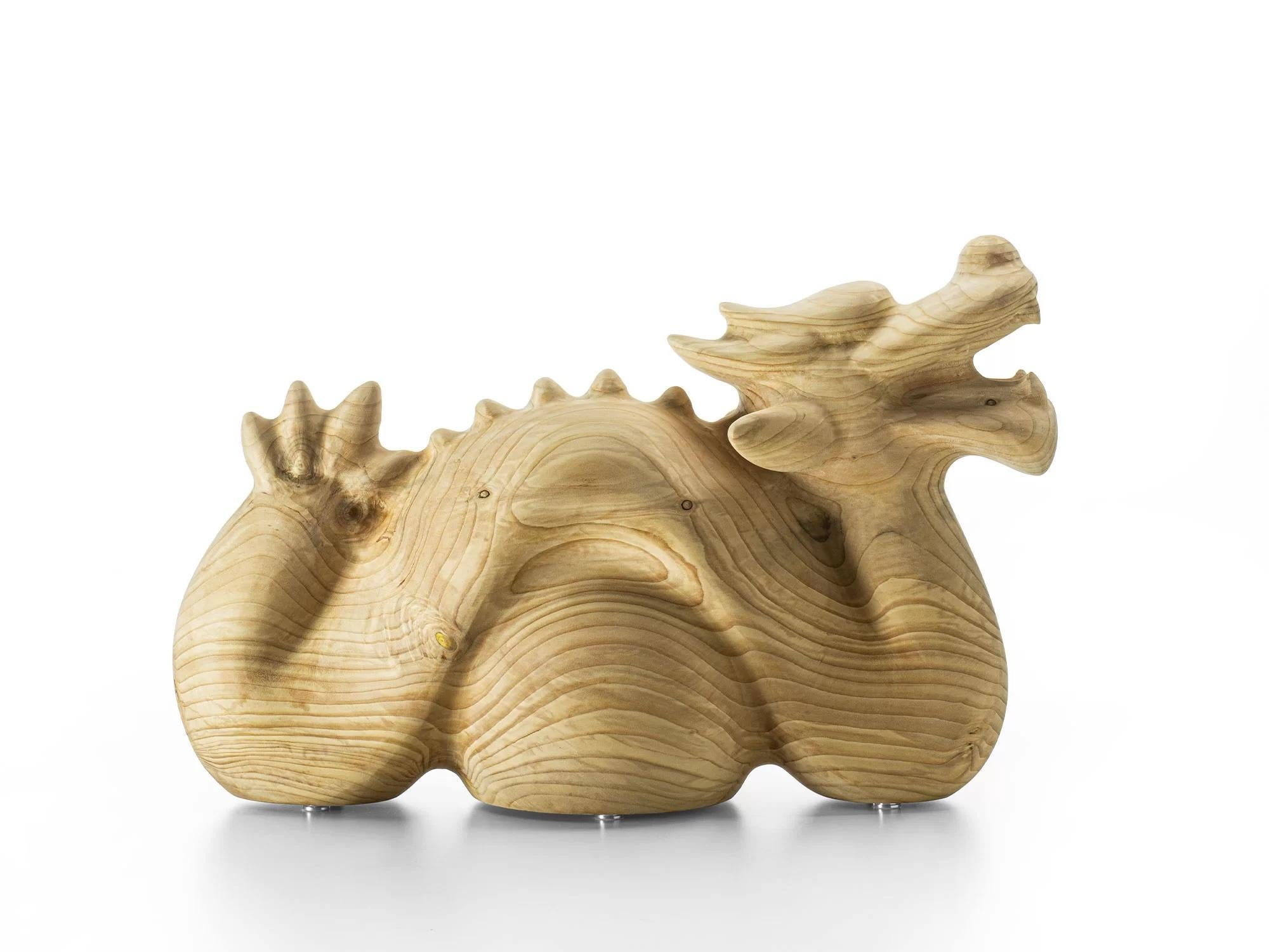 An exquisite furnishing accessory made from a single block of solid scented Cedarwood of Lebanon, its design celebrates the Chinese New Year by taking inspiration from the dragon, the symbol of lunar year 2024. A design object becomes a graceful,