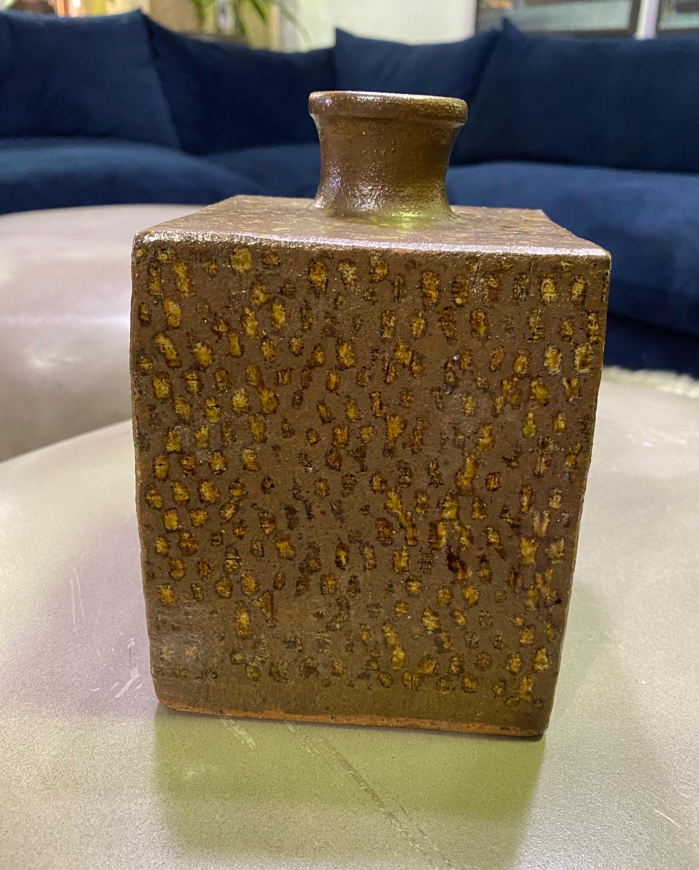 A wonderfully designed and gorgeously colored coveted square Mingei bottle vase by Japanese National Treasure pottery master Tatsuzo Shimaoka. This vase is an early work of Shimaoka's before he started to use his impressed 