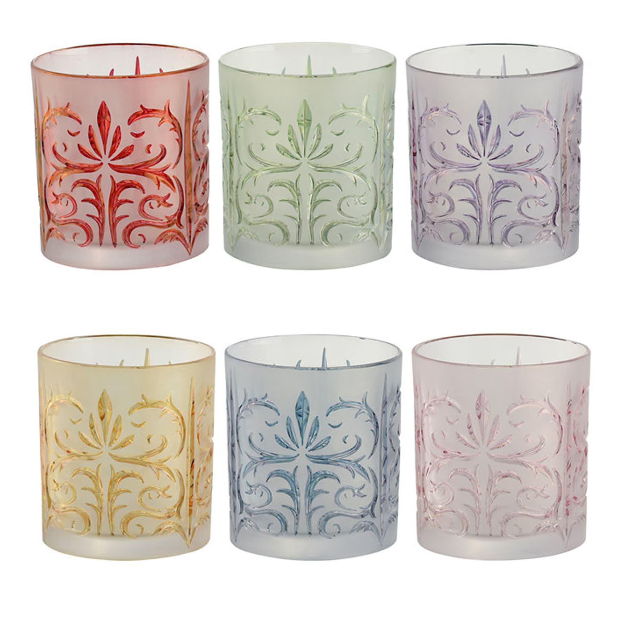 Part of the Tattoo Collection, this set of six water glasses is versatile and unique. The hand-decorated glass surface boasts a floral motif, stylized and timeless, each highlighted by a different color: red, mint, purple, gold, blue, and pink. An