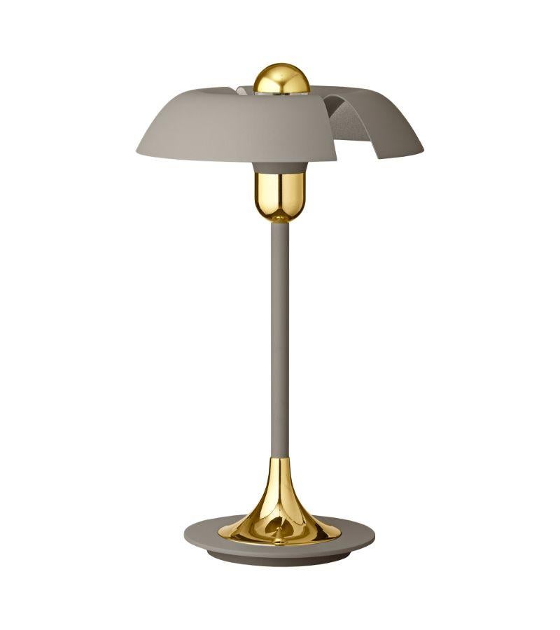Taupe and gold contemporary table lamp
Dimensions: Diameter 30 x Height 48 cm 
Materials: Aluminum with powder-coated. Brass plated details, Porcelain socket, plastic switch, and black textile cord. 
Details: For all lamps, the light source is E27