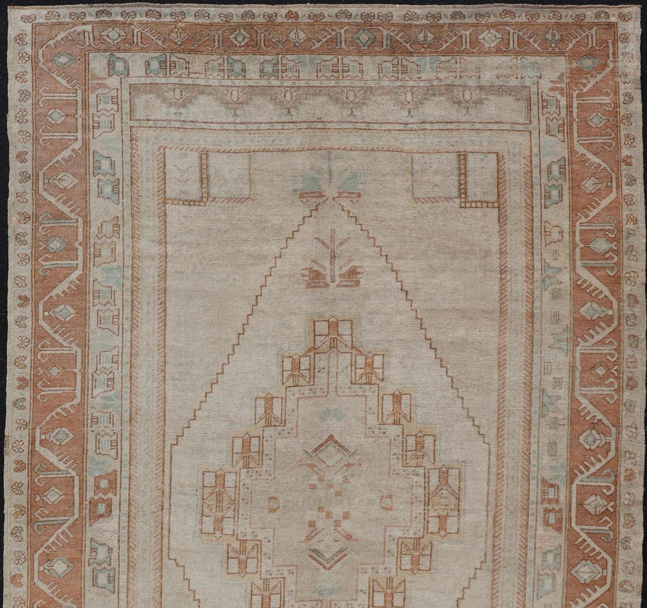 Wool Taupe Background Turkish Vintage Oushak Rug with Tribal Medallion Design For Sale