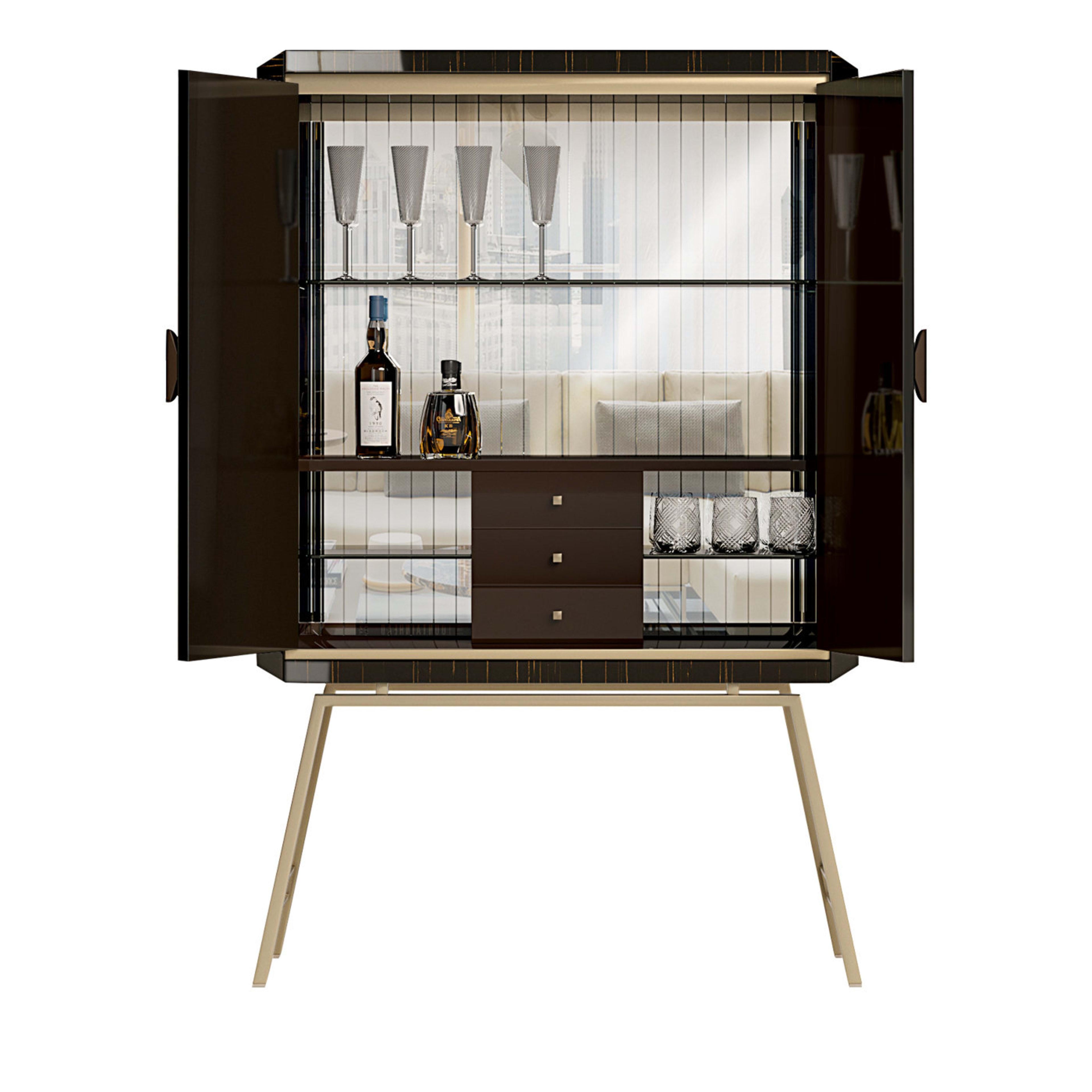 Imbued with a distinctive flair merging contemporary and modern influences, this bar cabinet features slender, slanted legs in champagne-finished metal supporting the cabinet's upper section. Lacquered in a timeless taupe hue, this superb bar