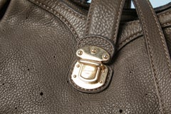 Taupe color monogram perforated crossbody bag with branded studs Louis Vuitton