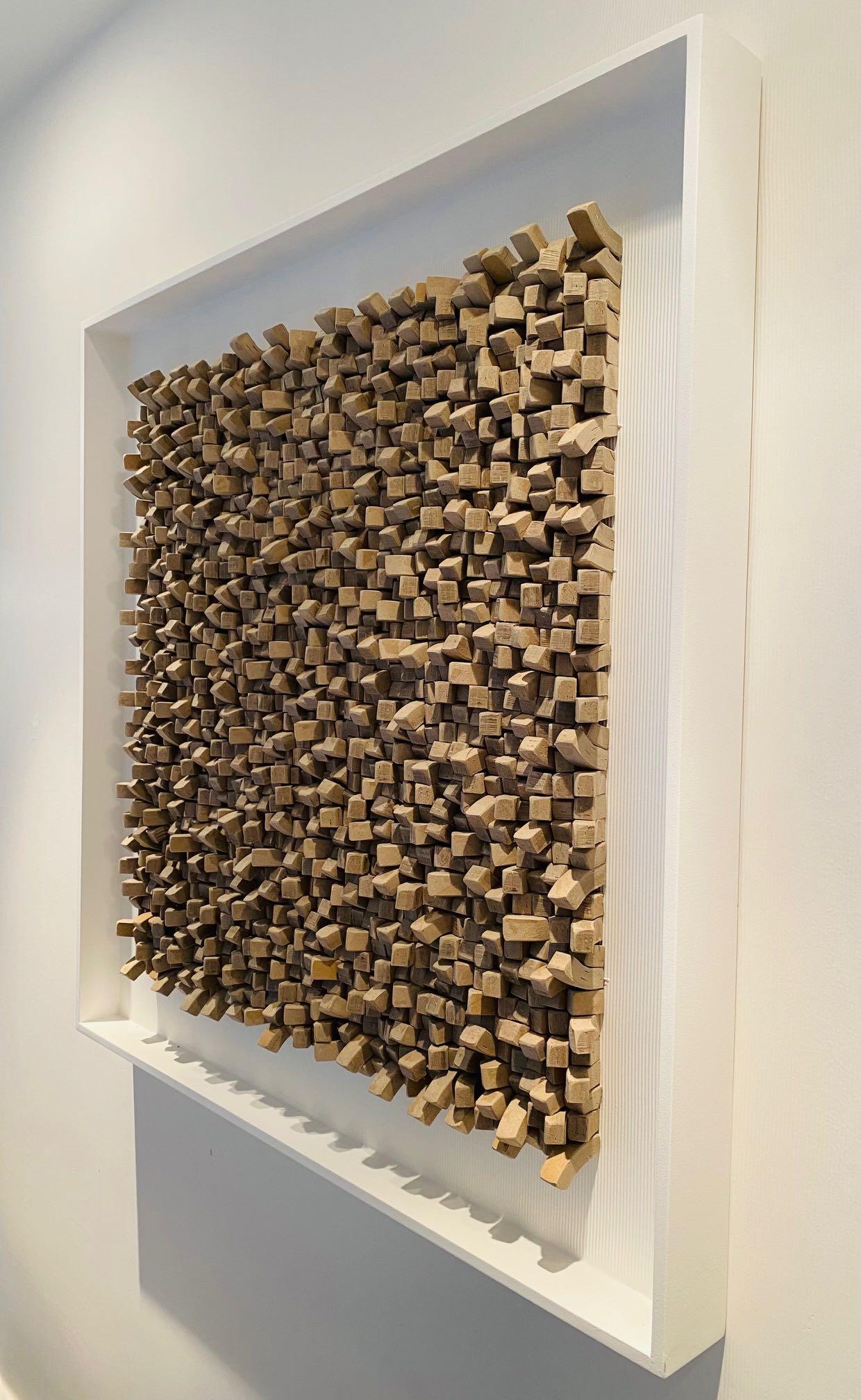 Contemporary artist Guy Leclef from his collection of Paper Works.
Folded taupe colored paper into small cubes give a three dimensional appearance.
Creates a very unique and dramatic wall sculpture.
Vertical ribbed textured matting and white wood