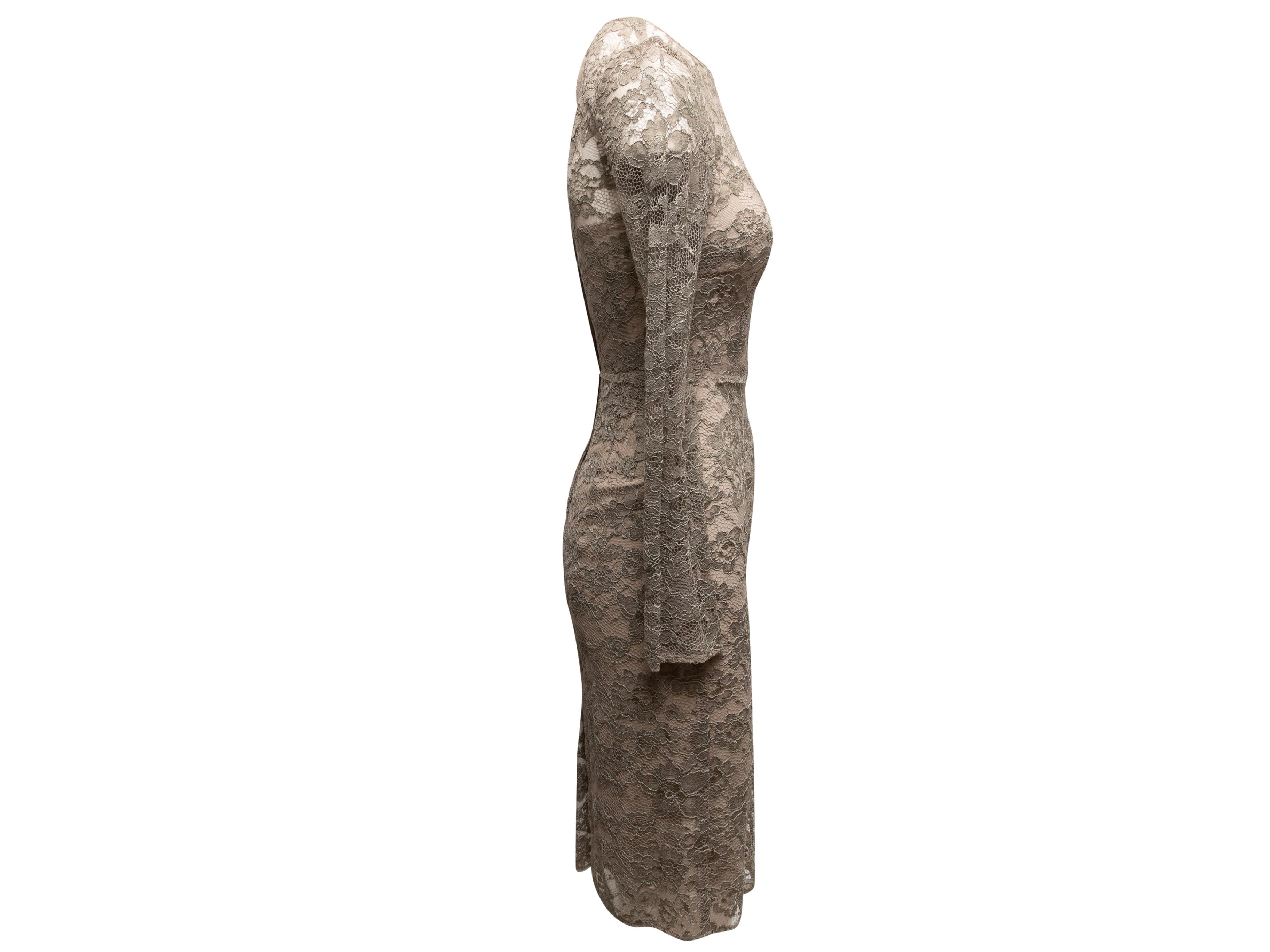 Product Details: Taupe silk-lined lace dress by Dolce & Gabbana. Crew neck. Long sleeves. Zip closure at center back. 30