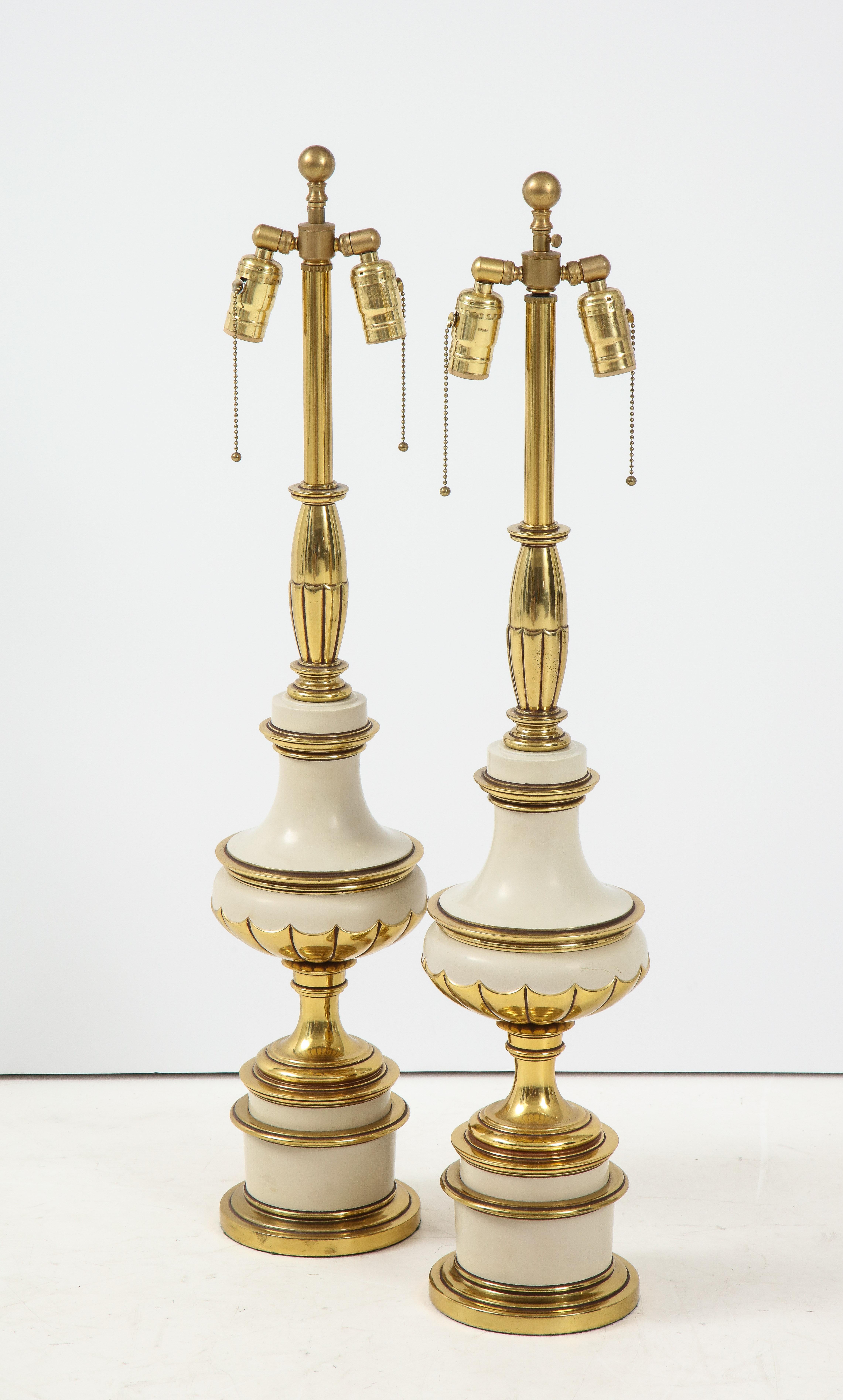 Exquisite pair of heavy construction Hollywood Regency taupe/mushroom colored enamel and brass lamps featuring double pull chain sockets. Rewired for use in USA, 100W max bulbs.
