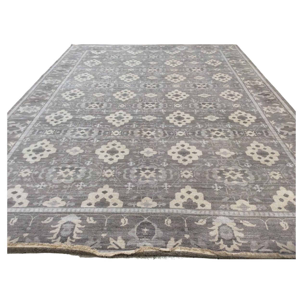 Make a strong statement in a large space with this finely balanced diamond pattern in taupe grey. Bold enough to perform on its own but would work equally well as a stage on which contemporary furniture can star. Handcrafted in India. Wool.