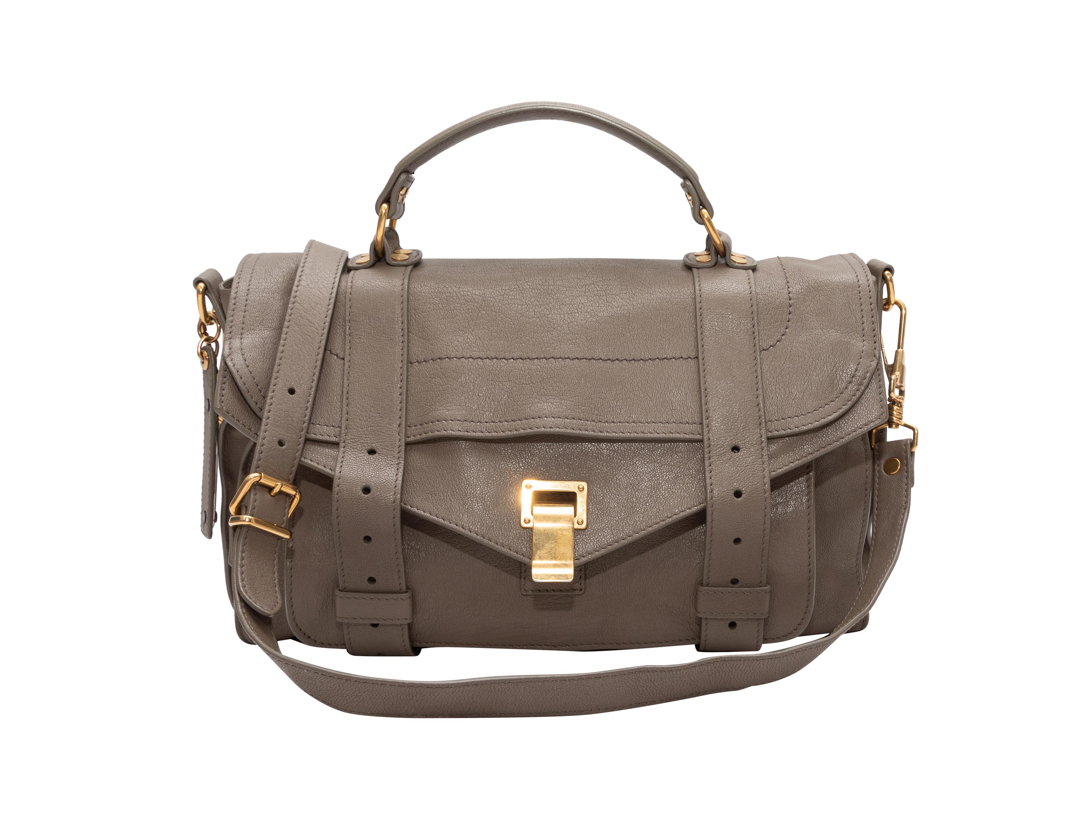 Taupe Proenza Schouler PS1 Messenger Bag. The PS1 Messenger Bag features a leather body, gold-tone hardware, a single flat top handle, a single flat shoulder strap, a single exterior back zip pocket, and front flap closure. 13.5