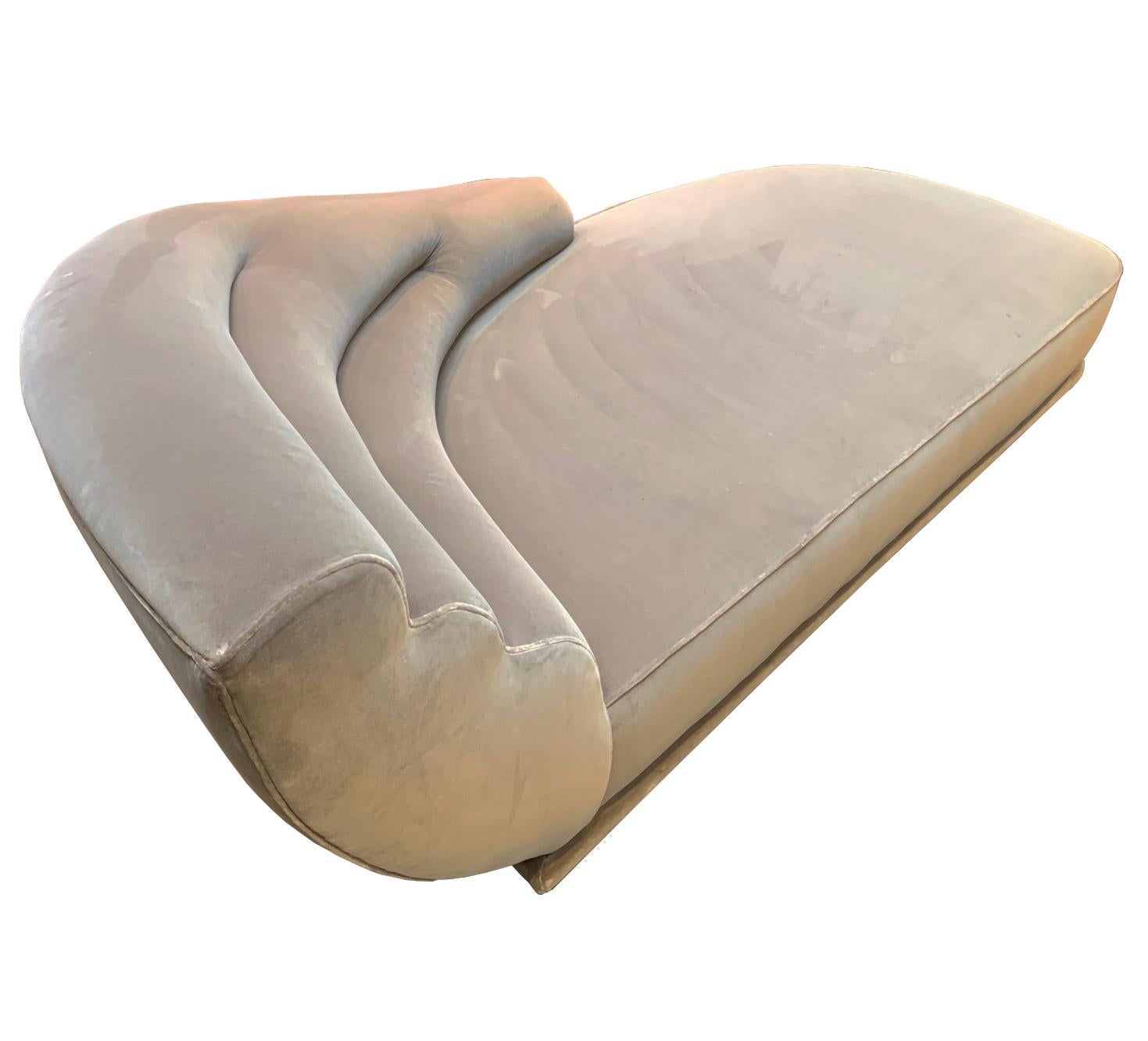 Introducing the 'Gina' Chaise Longue by Promemoria, Italy.

A masterpiece of luxury furniture design that blends functionality with opulent style. This large chaise longue is a marvel of Streamline Moderne aesthetics, featuring undulating lines that