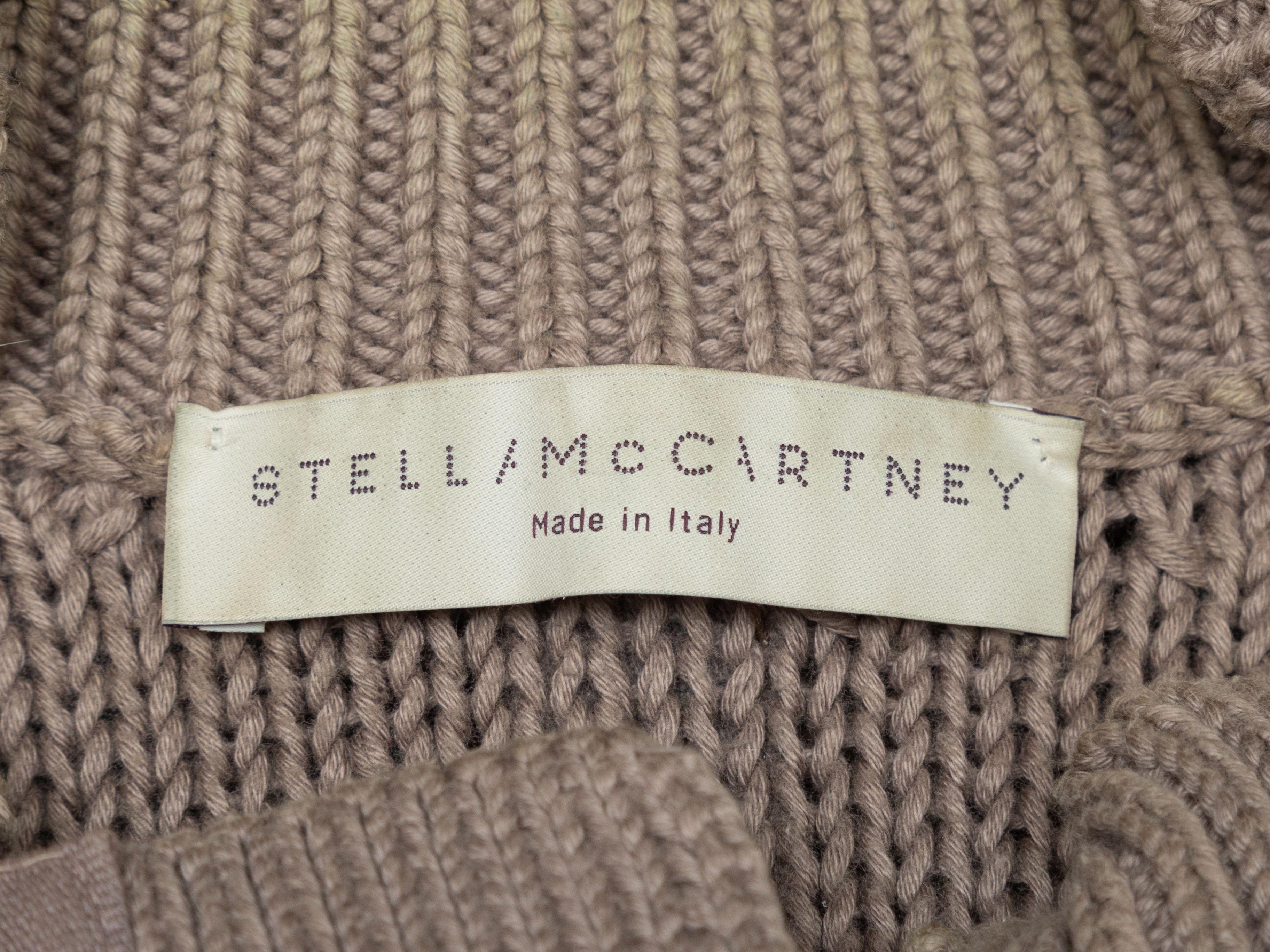 Product Details: Taupe cotton short dolman sleeve cardigan by Stella McCartney. Crew neck. Dual patch pockets at hips. D-ring and zip closures at front. Designer size 40. 38