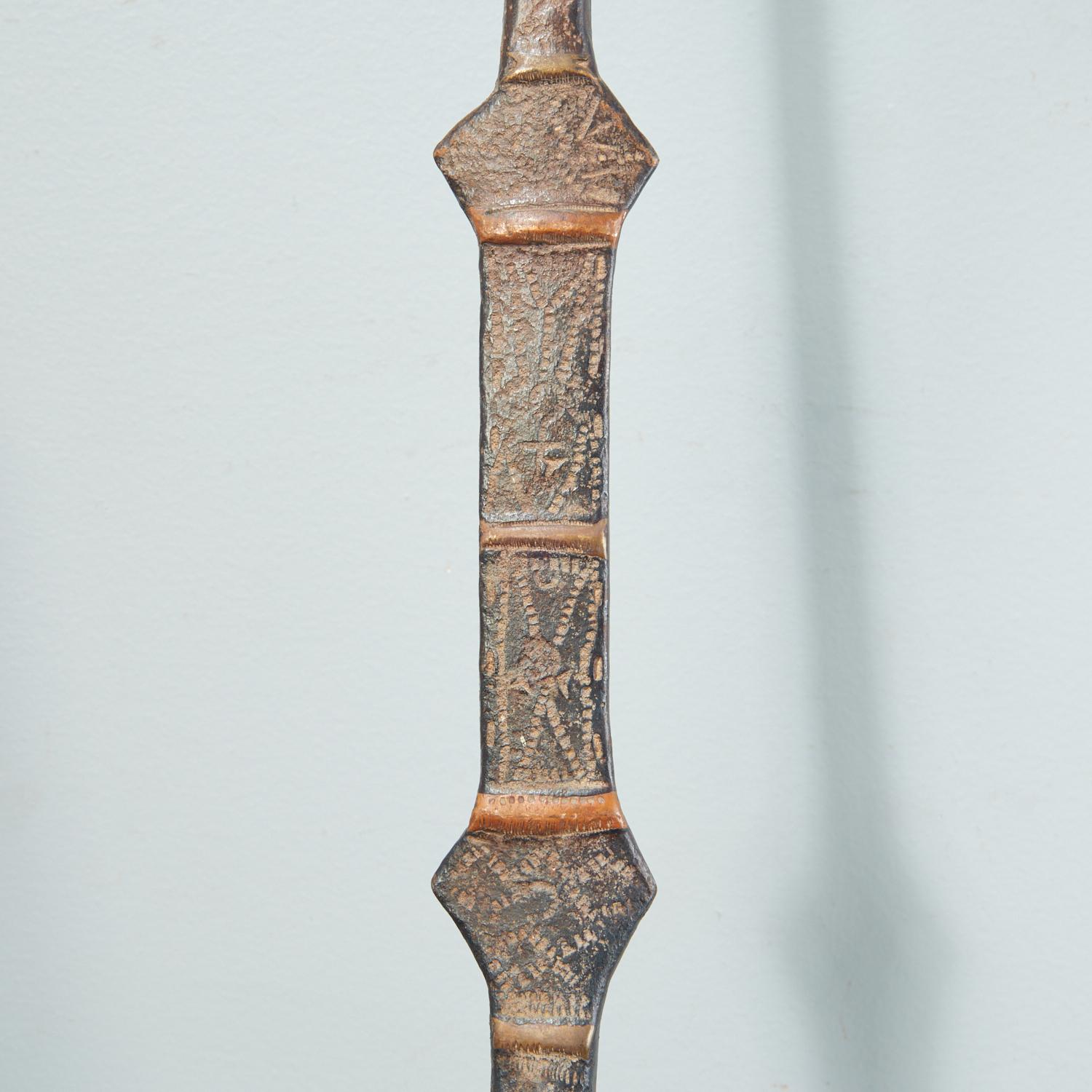 19th c., Niger Region, currencies of forged iron, each with long stem incised with geometric decoration, terminating in a horseshoe-shaped blade.

Dimensions:
58