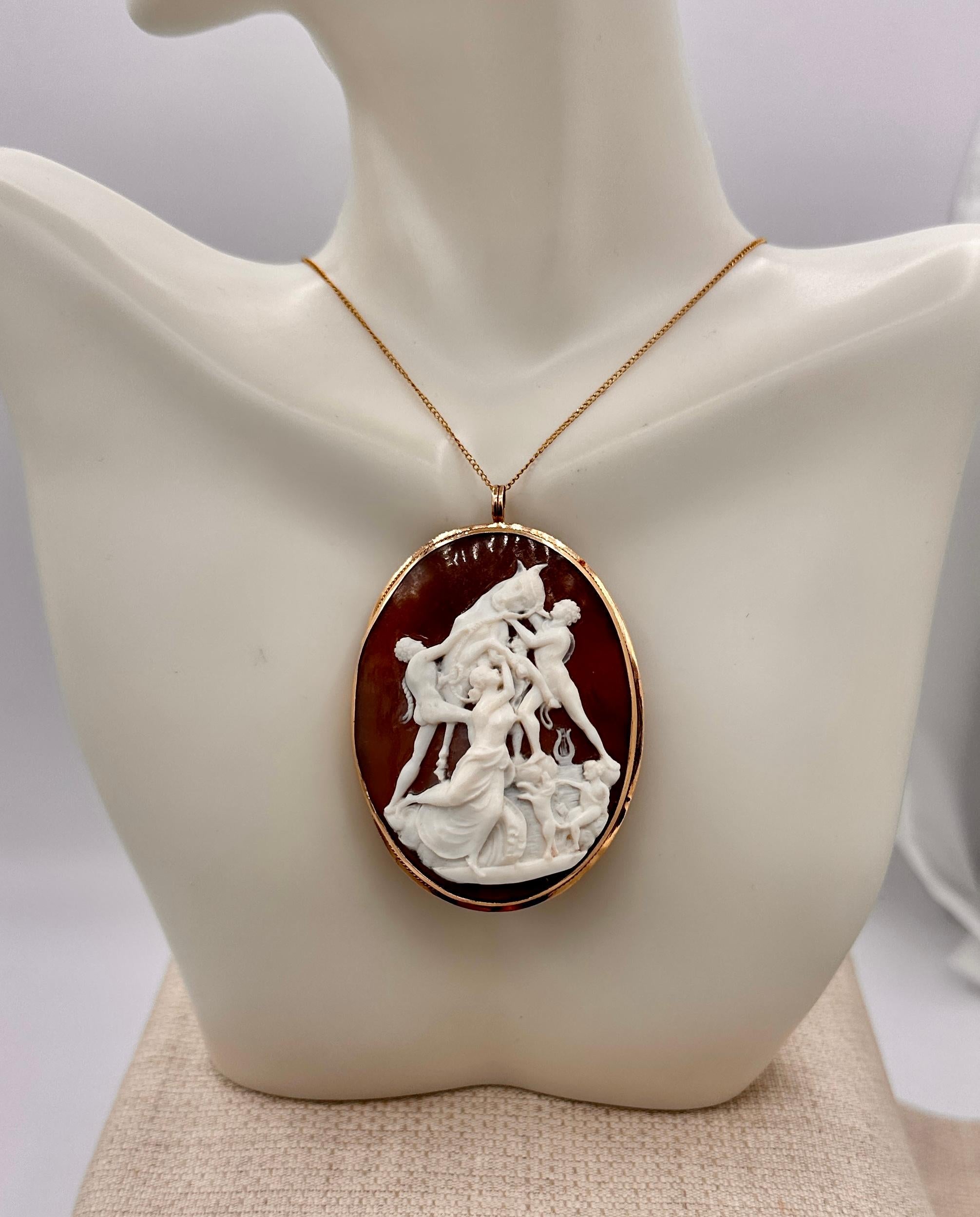 This is an absolutely stunning and very rare large antique Shell Cameo Pendant Brooch with a hand carved image of the bull, Taurus, or the Goddess Europa being abducted by Zeus in the form of a bull with nudes and an attendant dog!  The cameo is set