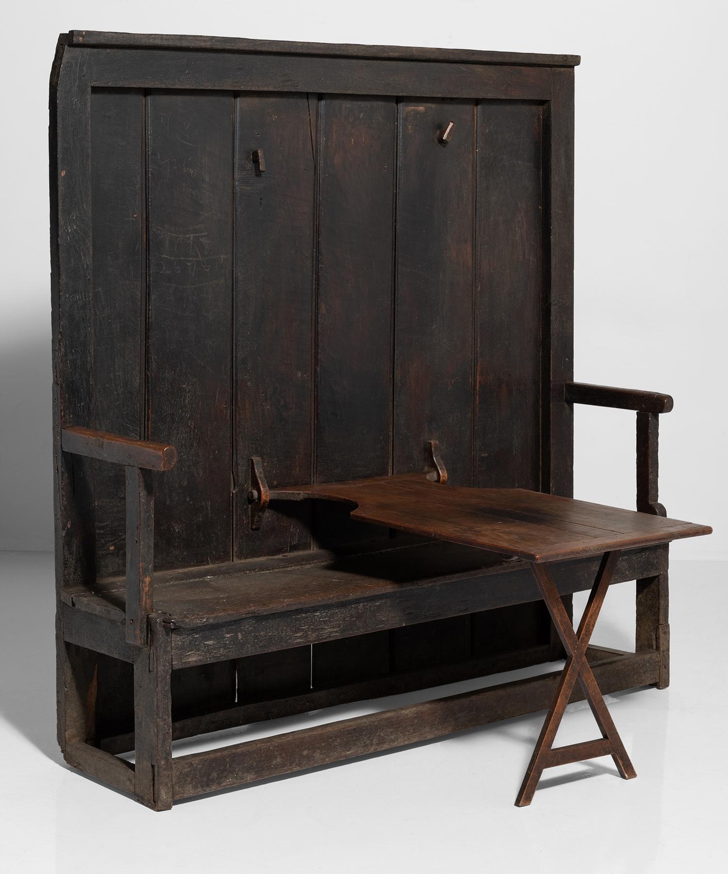 Tavern settle with table, England, 19th century.

Unique settle with folding table.

Measures: 67.5” W x 21” D x 70” H x 17” seat / 22.75” W x 40” D x 25” H (table).