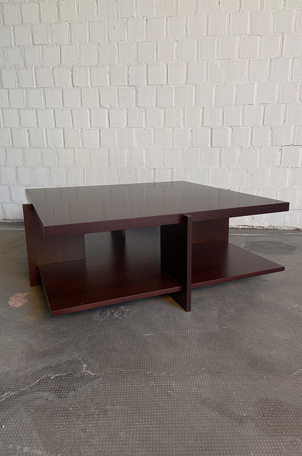 Coffee table designed by Frank Lloyd Wright for Cassina in 1996.
Composed of overlapping and interlocking wooden surfaces, the end result is a solid table with simple yet elegant lines. Unique piece, no longer in production. Numbered No. 03.