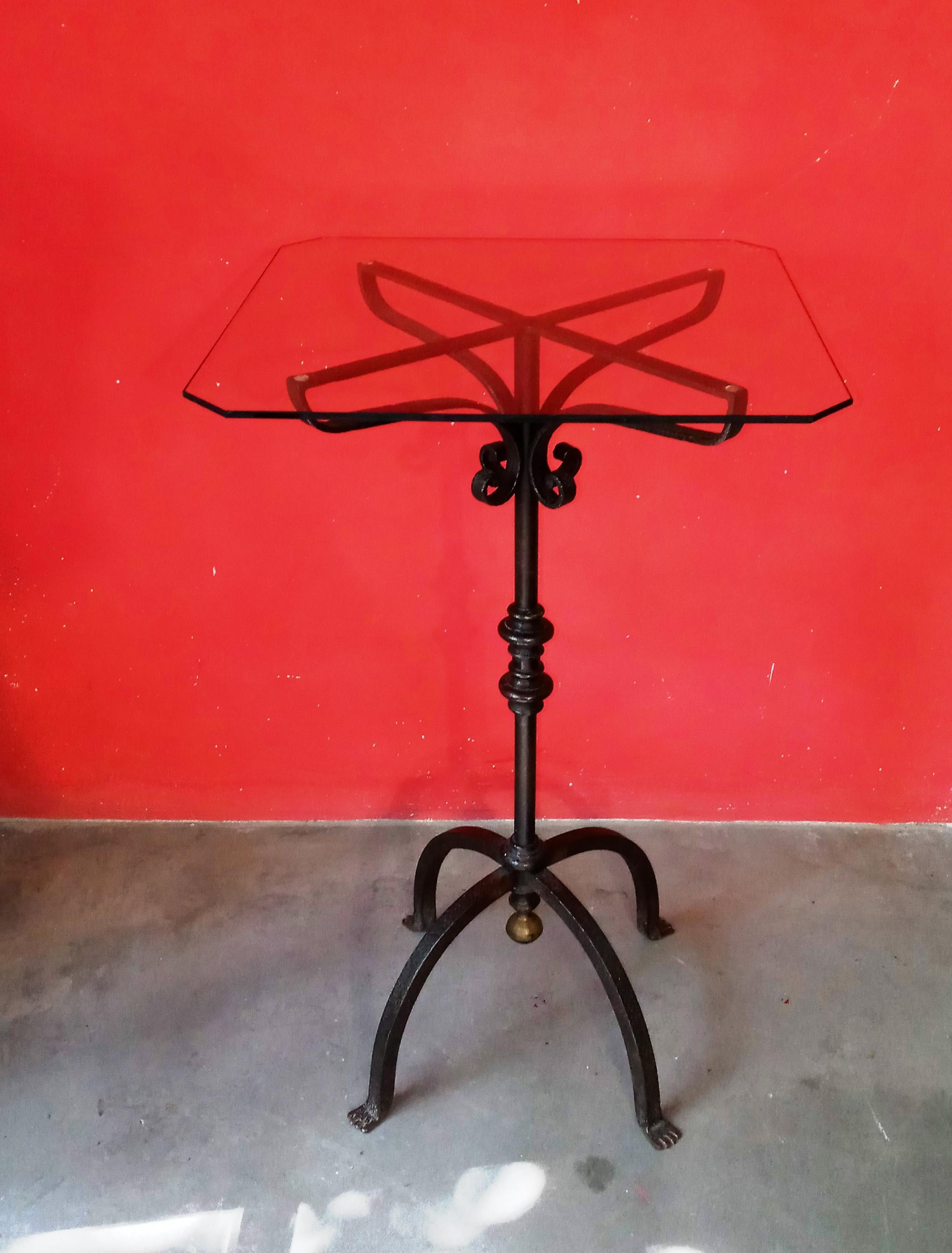 tall service table, wrought iron. rough iron frame, made by Italian master ironworker in the 1940s. renaissance-inspired design freely interpreted. glass top with beveled edges