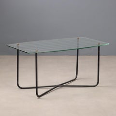 1950s coffee table by Jacques Hitier with a rectangular glass top.